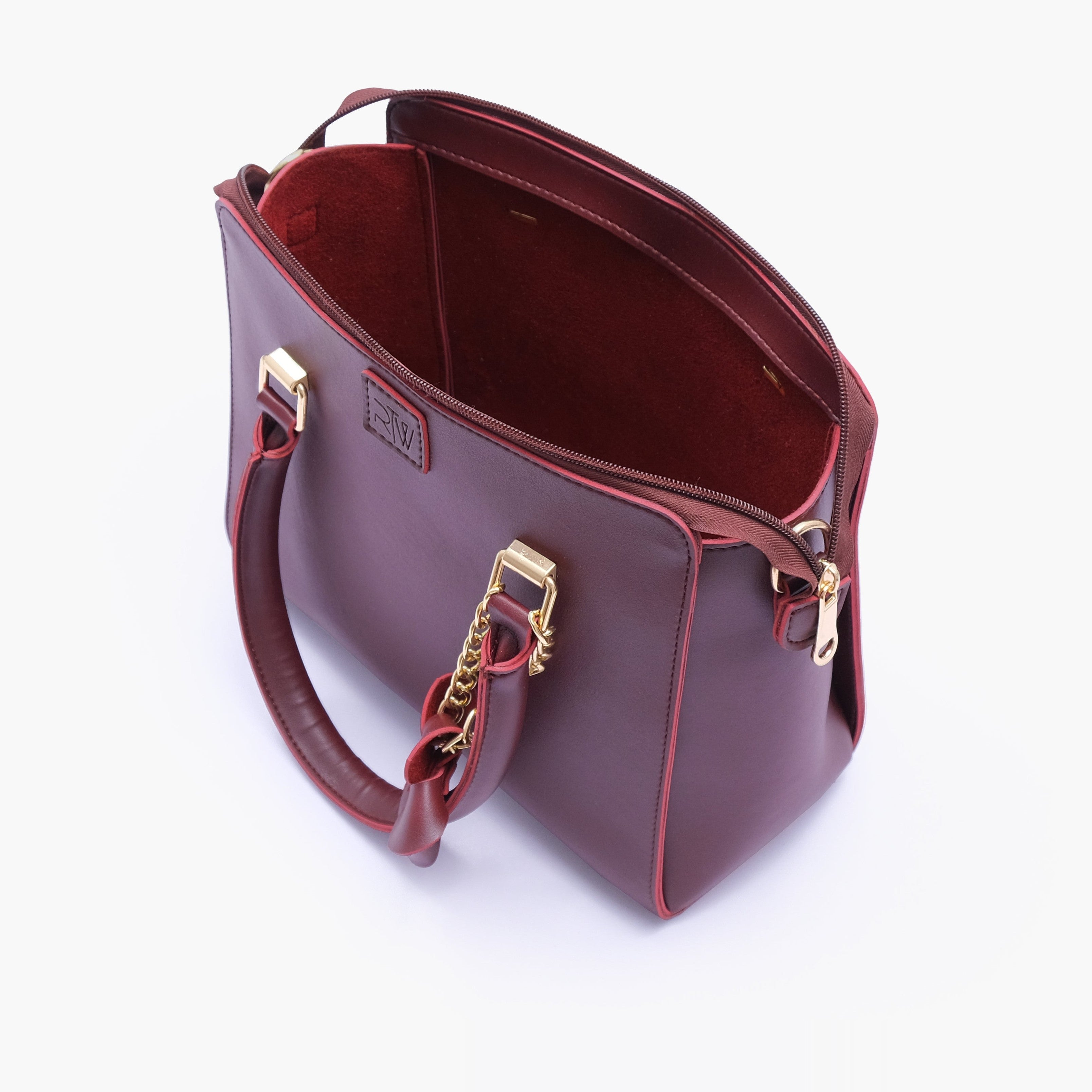 Burgundy handbag with flower charm