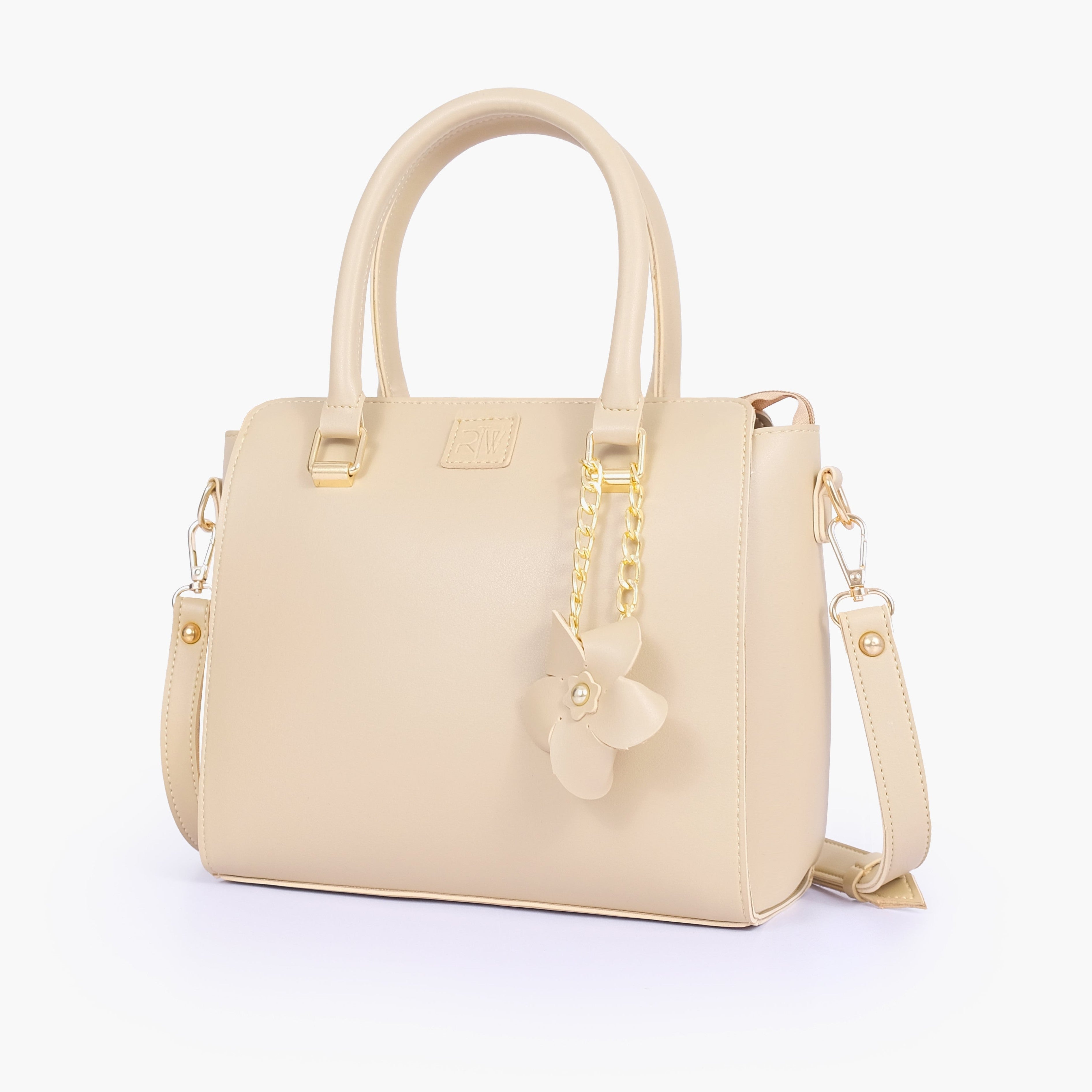 Off-white handbag with flower charm
