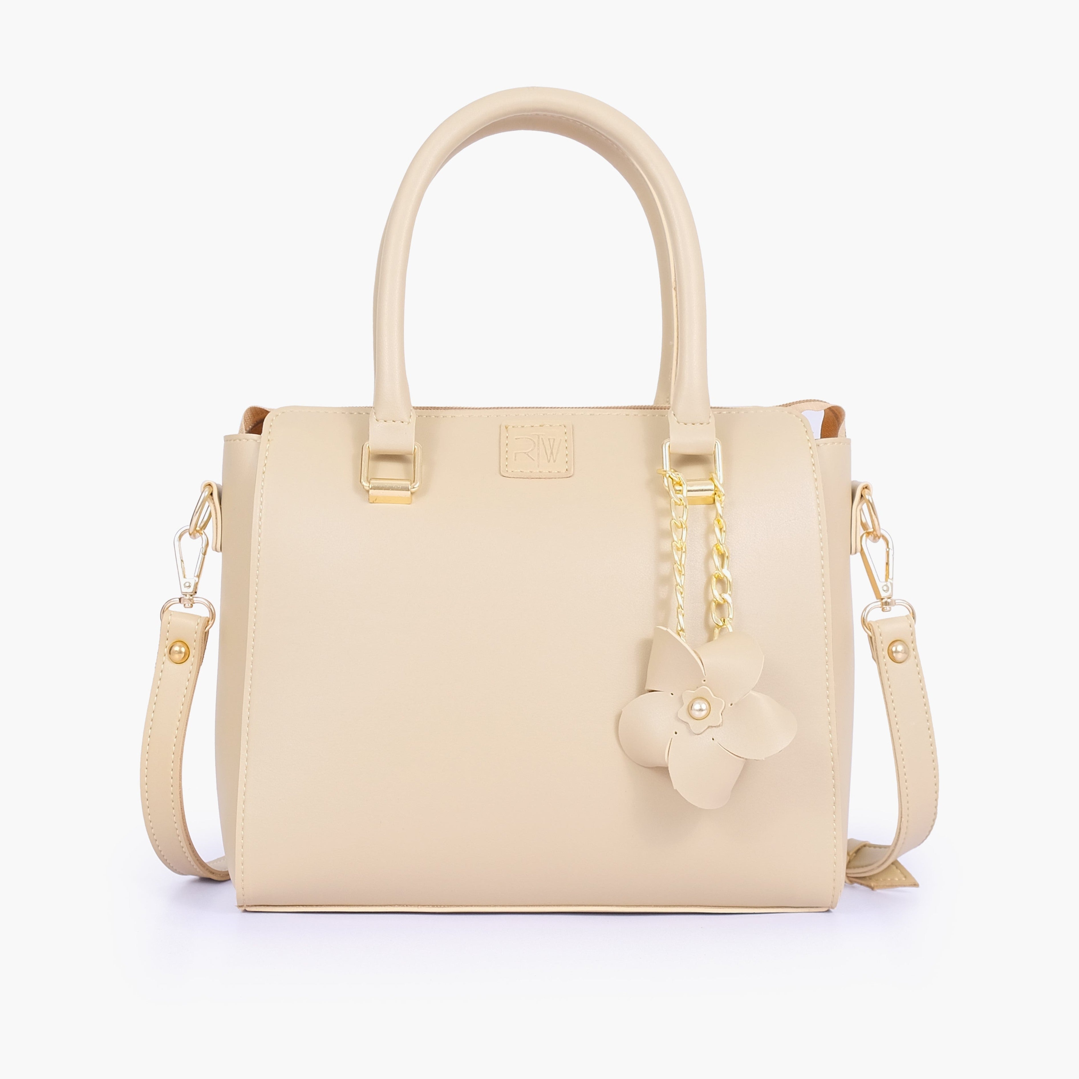 Off-white handbag with flower charm