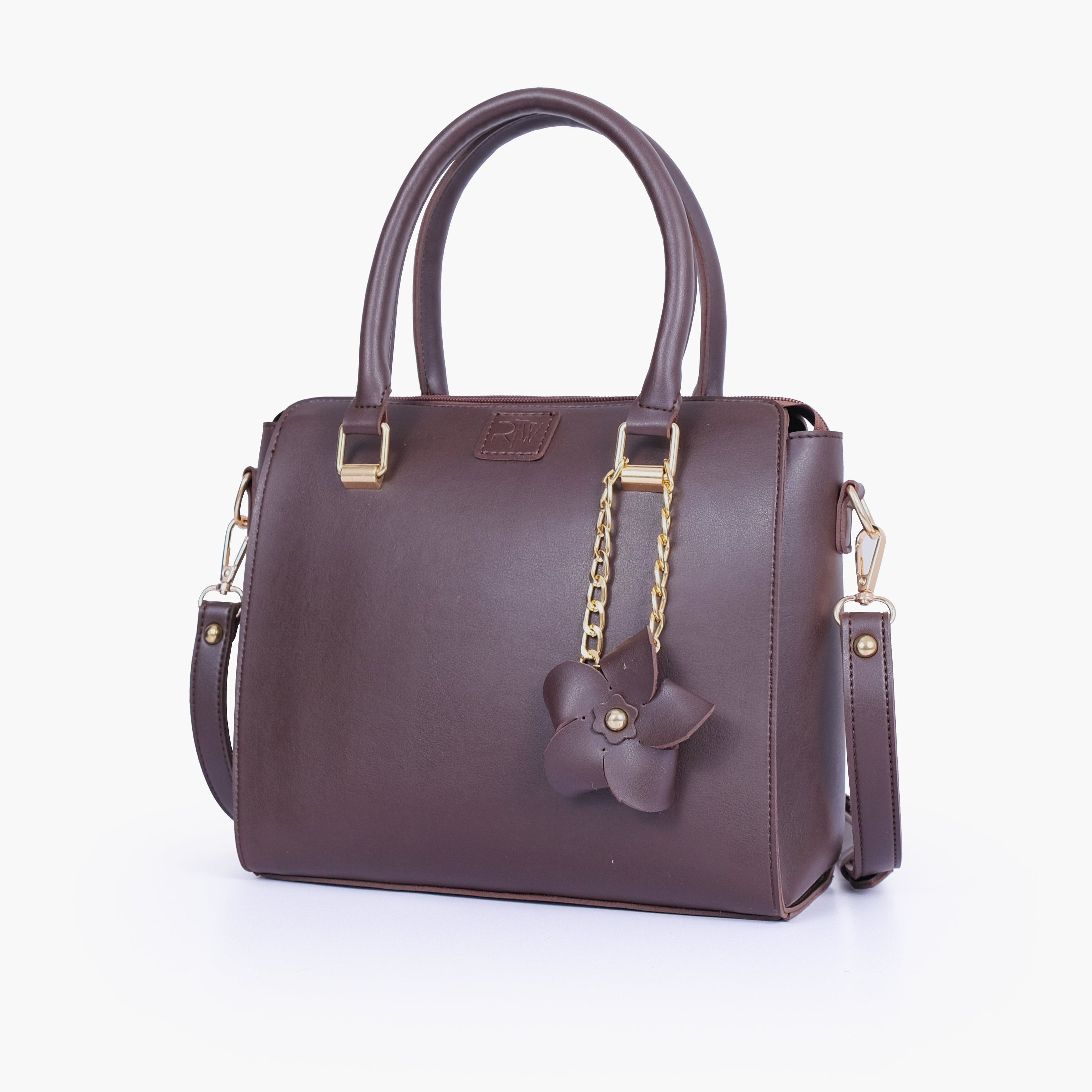 Dark brown handbag with flower charm