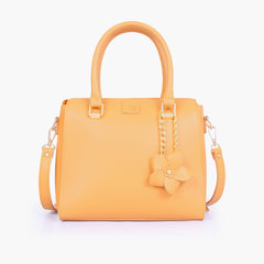 Mustard handbag with flower charm
