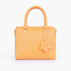 Mustard handbag with flower charm