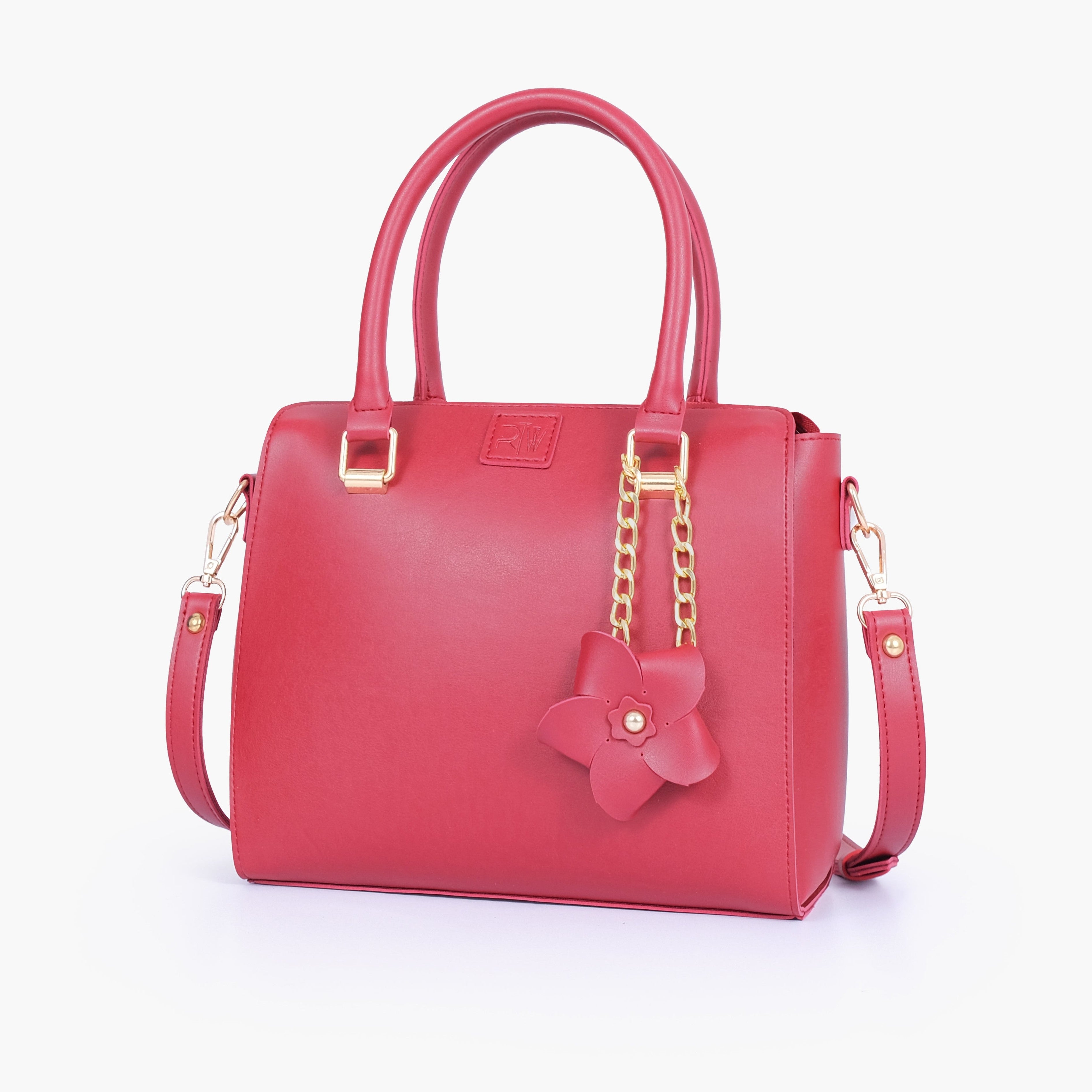 Maroon handbag with flower charm