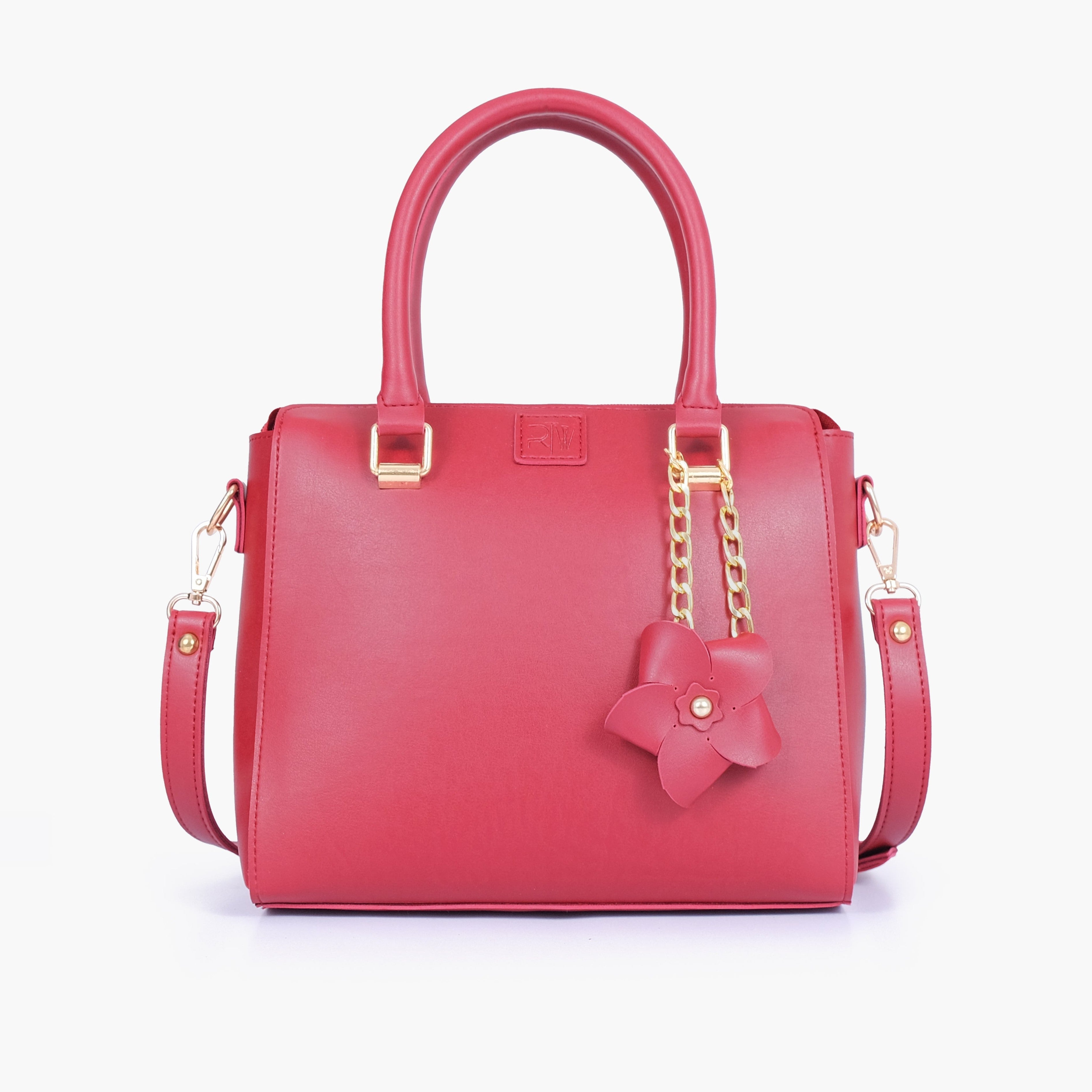 Maroon handbag with flower charm
