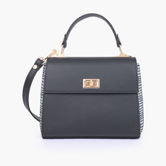 Black and white criss-cross top-handle bag