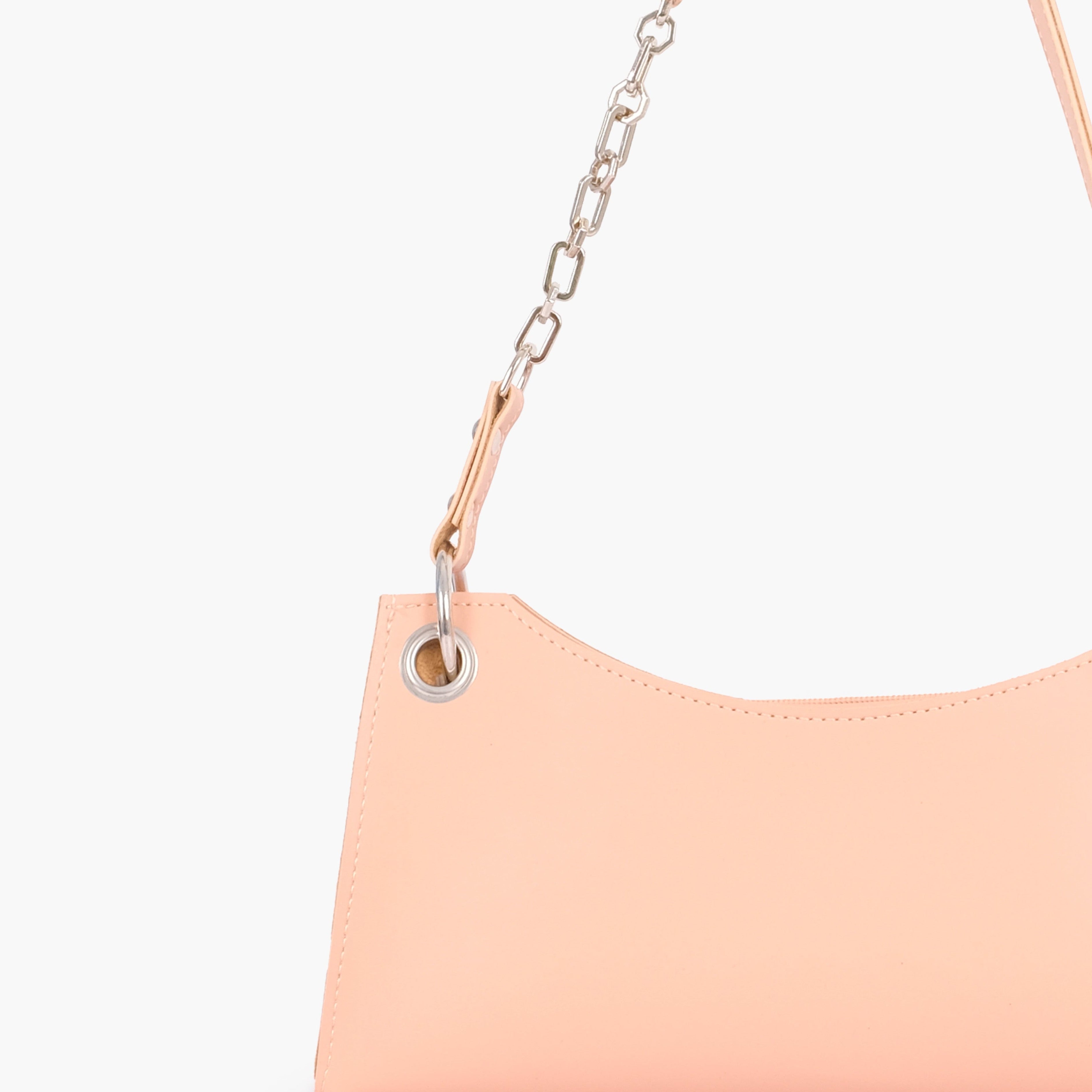 Peach elongated chain handle purse