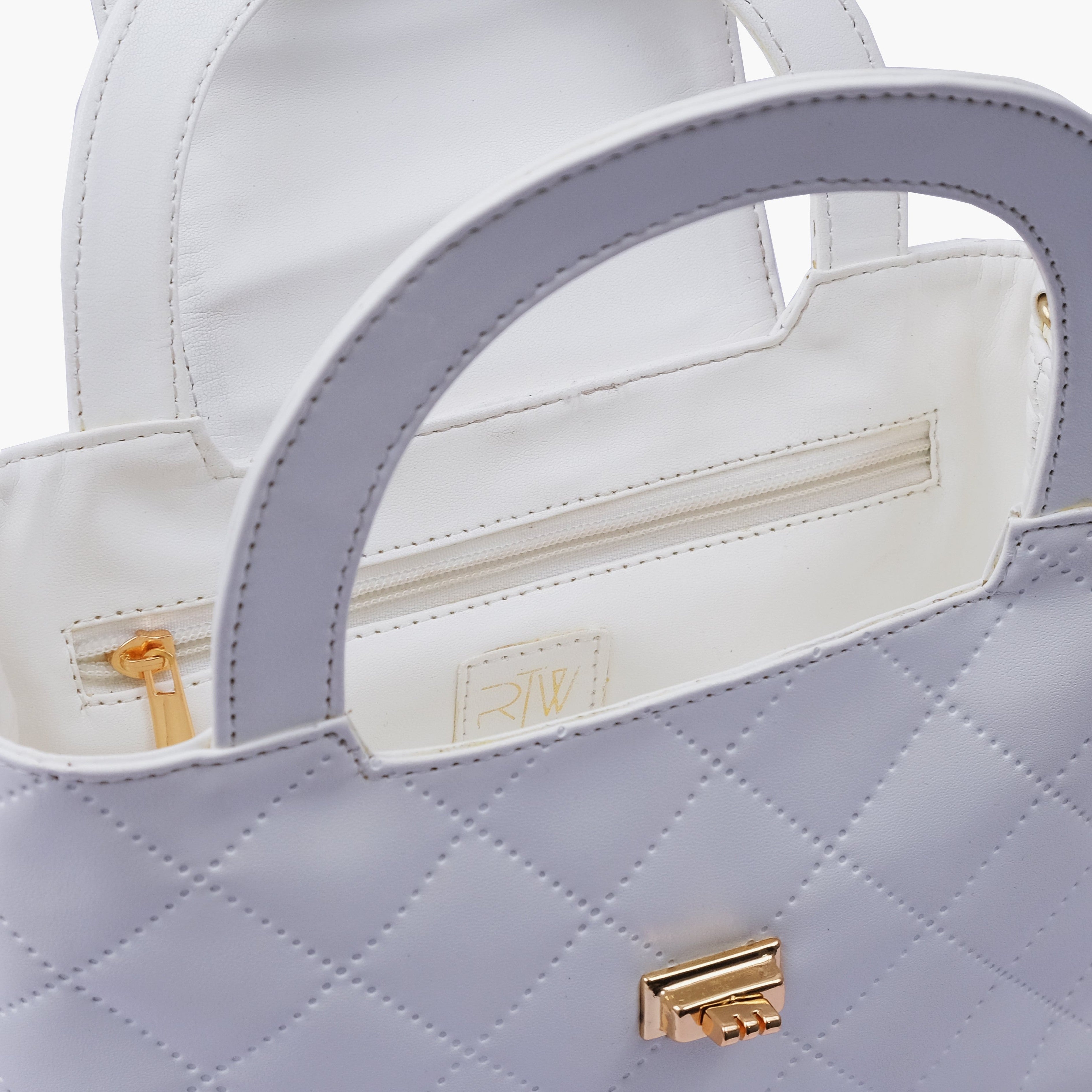 White flap quilted bag with top handle