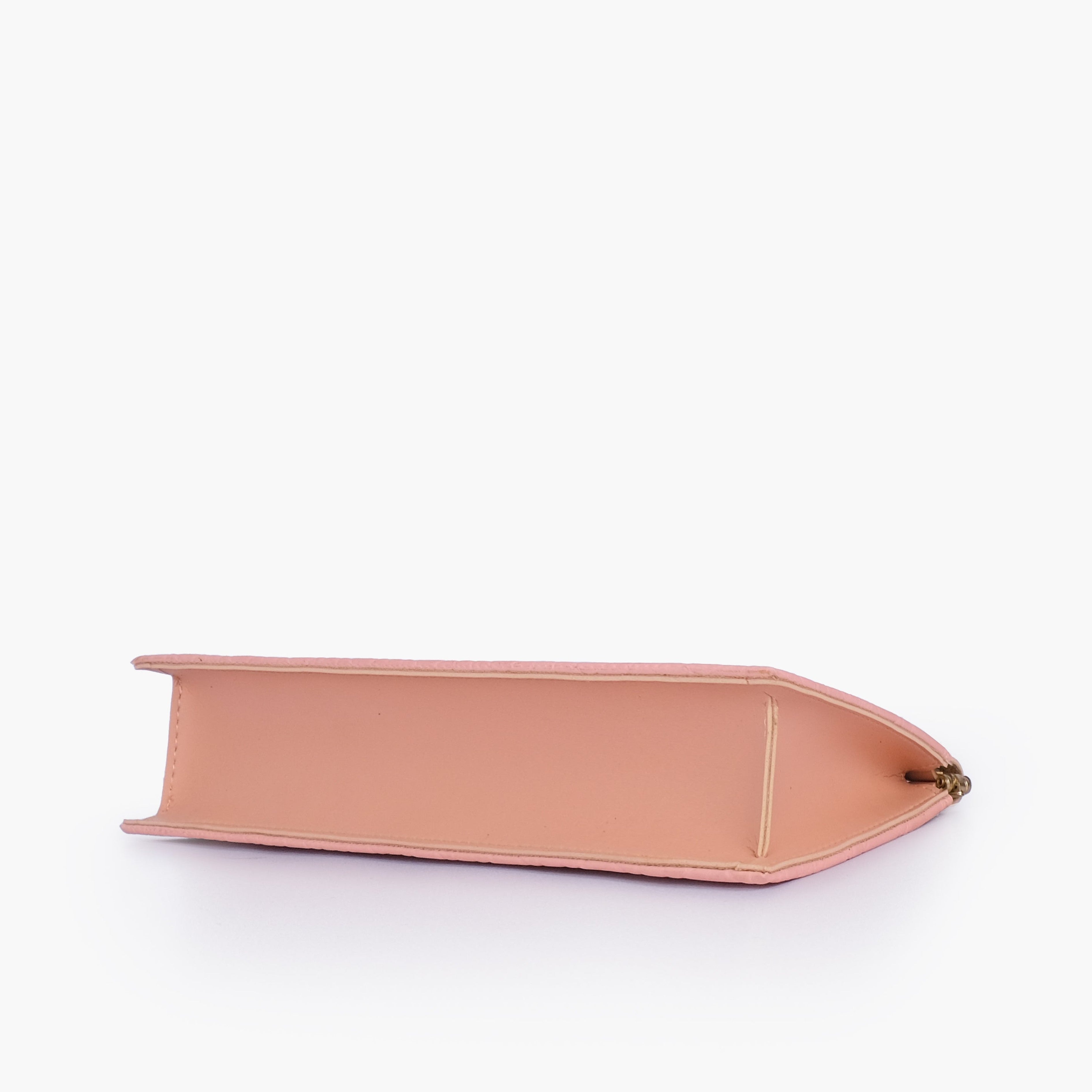Peach quilted evening clutch with snap closure