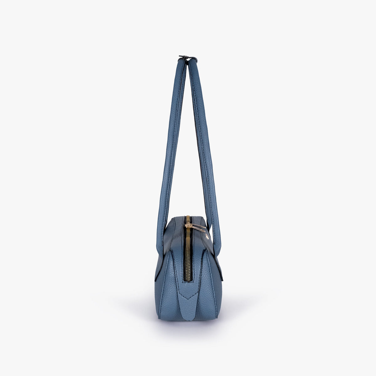 Side profile of blue east-west baguette bag