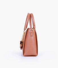 Brown handbag with flower charm