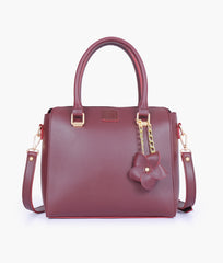 Burgundy handbag with flower charm