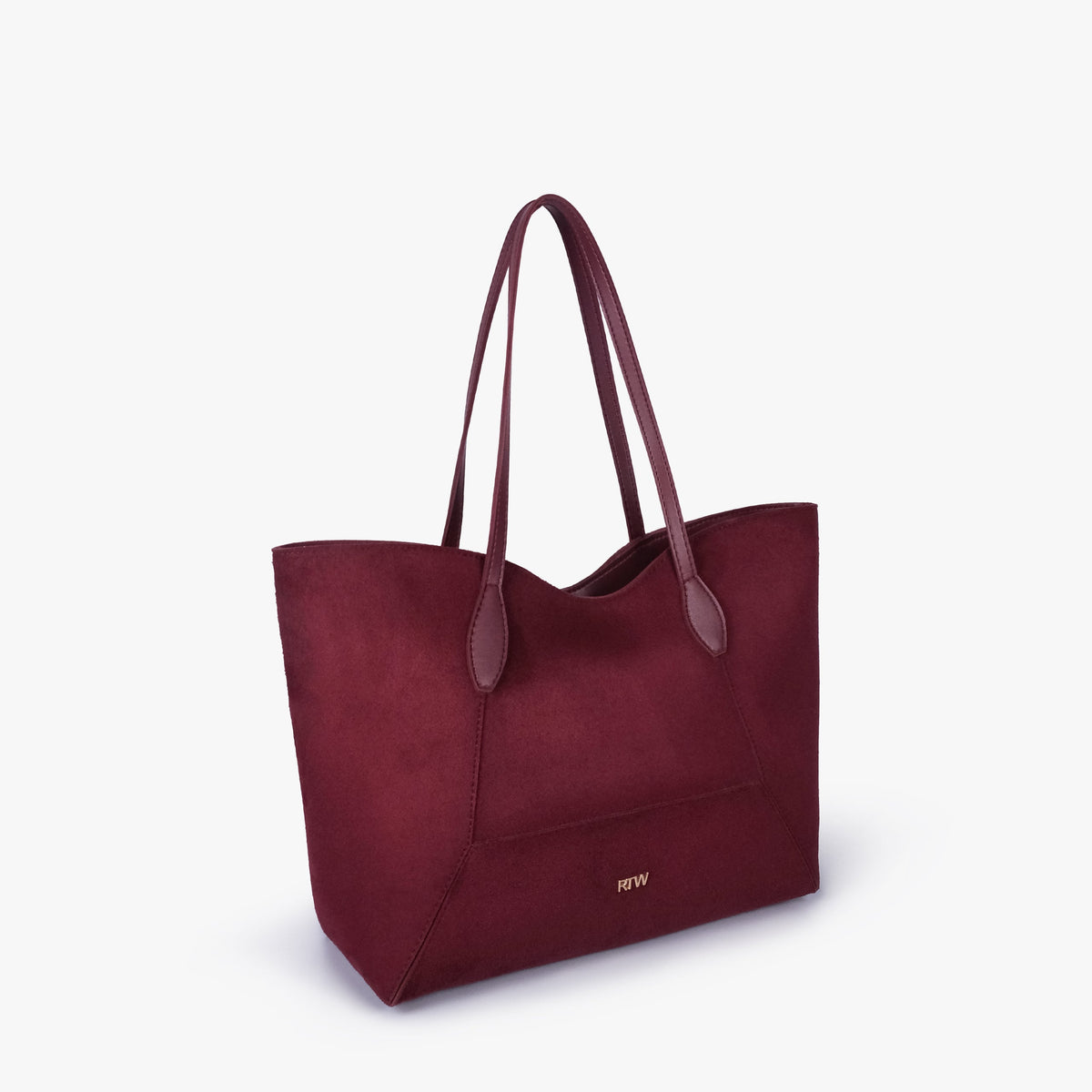 Burgundy suede Arc tote bag in three-quarter view