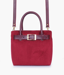 Burgundy suede handbag with front buckle