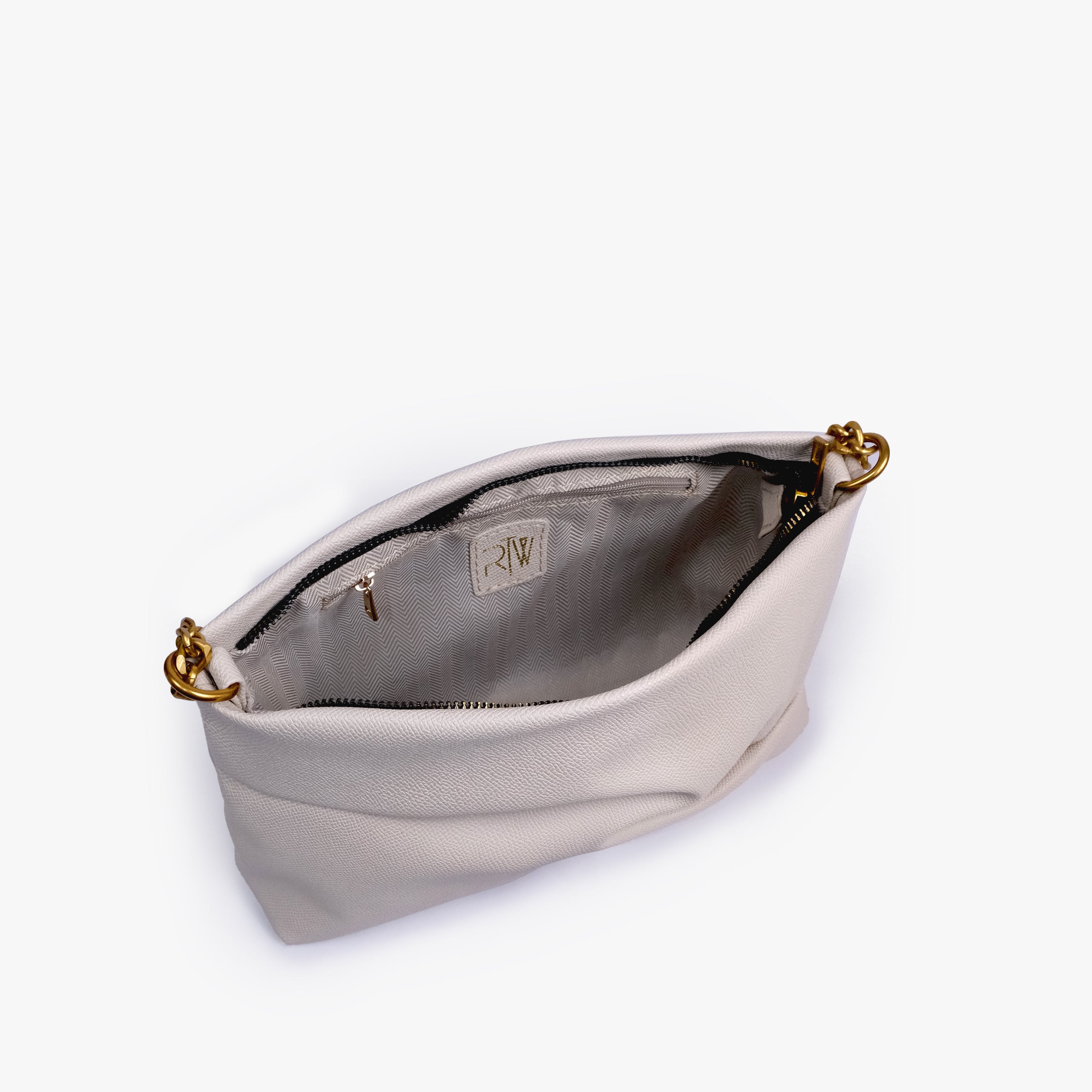 Cream pleated clutch bag with chain — open interior view showing the zipper closure, light lining, RTW label and interior zip pocket, soft ivory cream