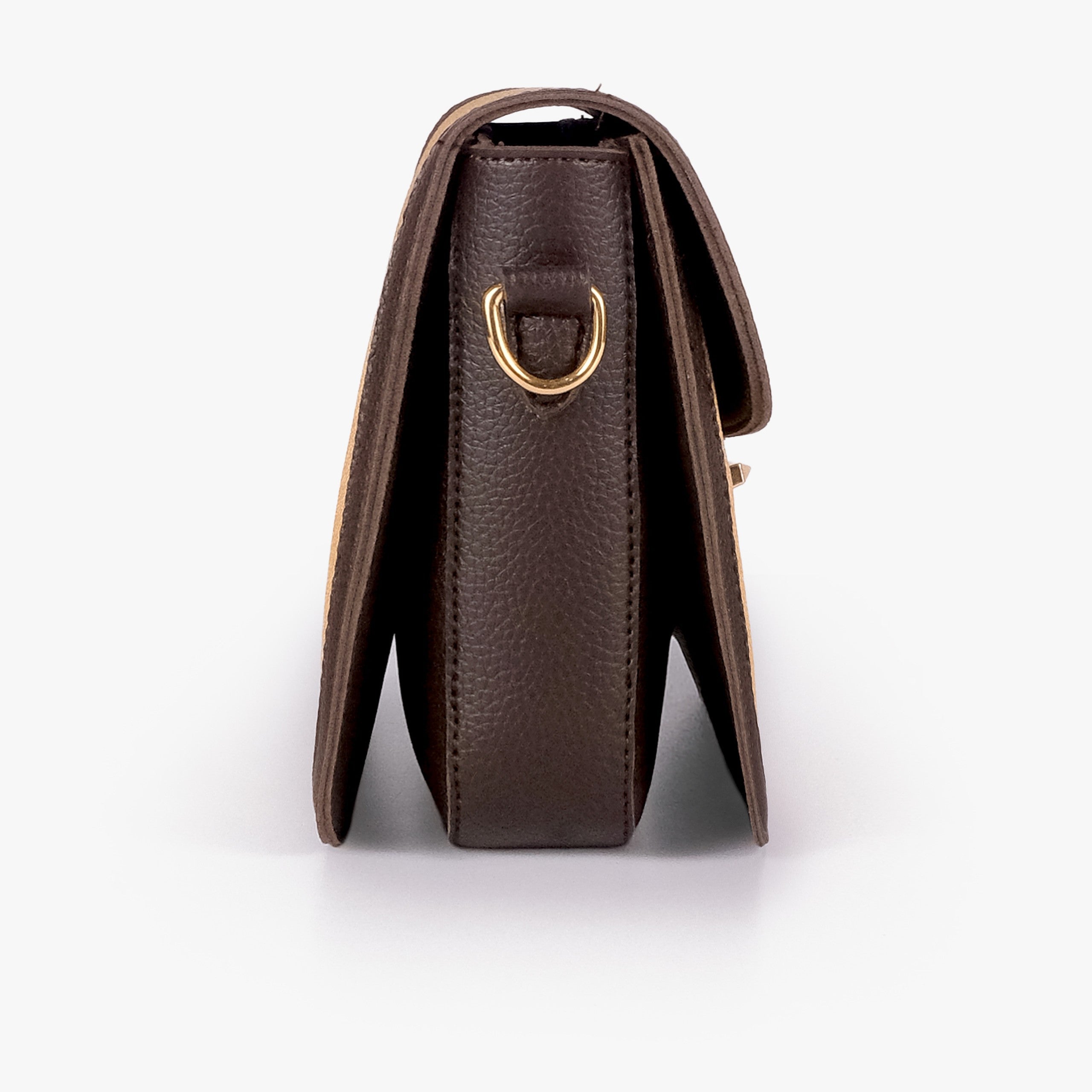 Beige contrast cross-body bag — side profile showing slim gusset and gold D-ring on espresso pebbled trim
