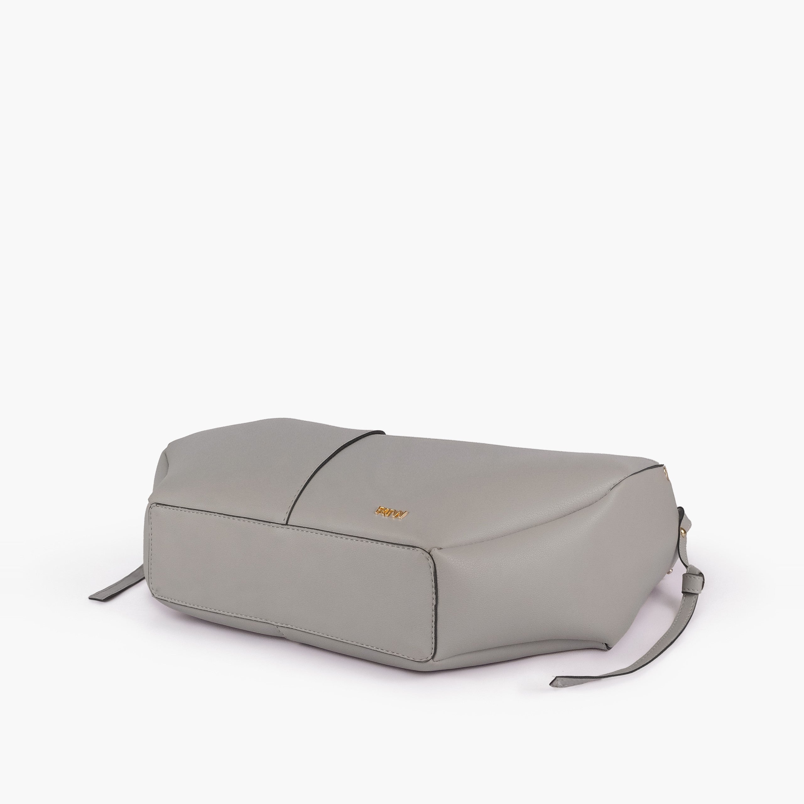 Grey atelier tote — base angle showing reinforced flat base, gold RTW logo on front-bottom face