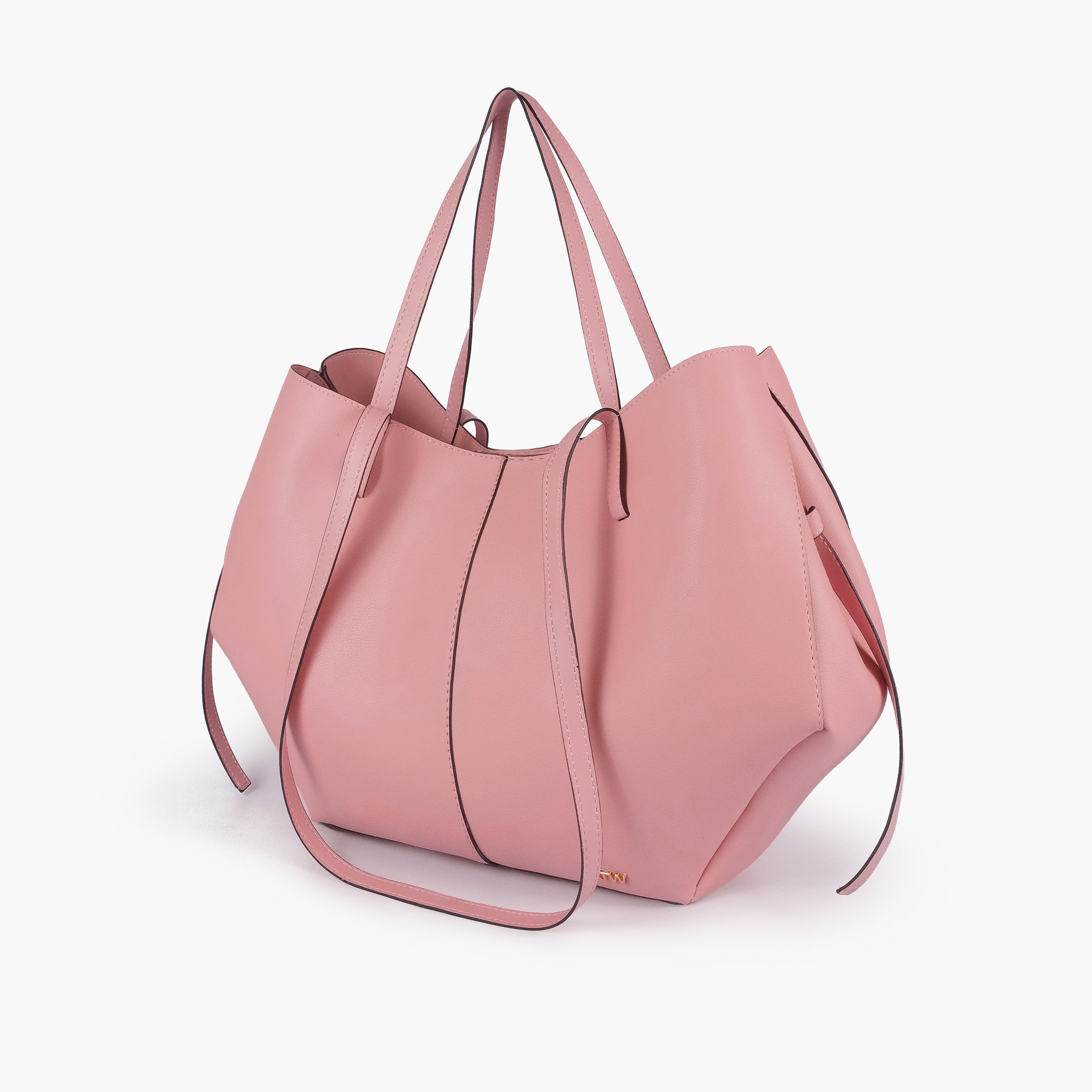 Pink atelier tote — hero 3/4 quarter view, dusty rose smooth faux leather, wing-cut origami side panels, slim handles, gold RTW logo at front base