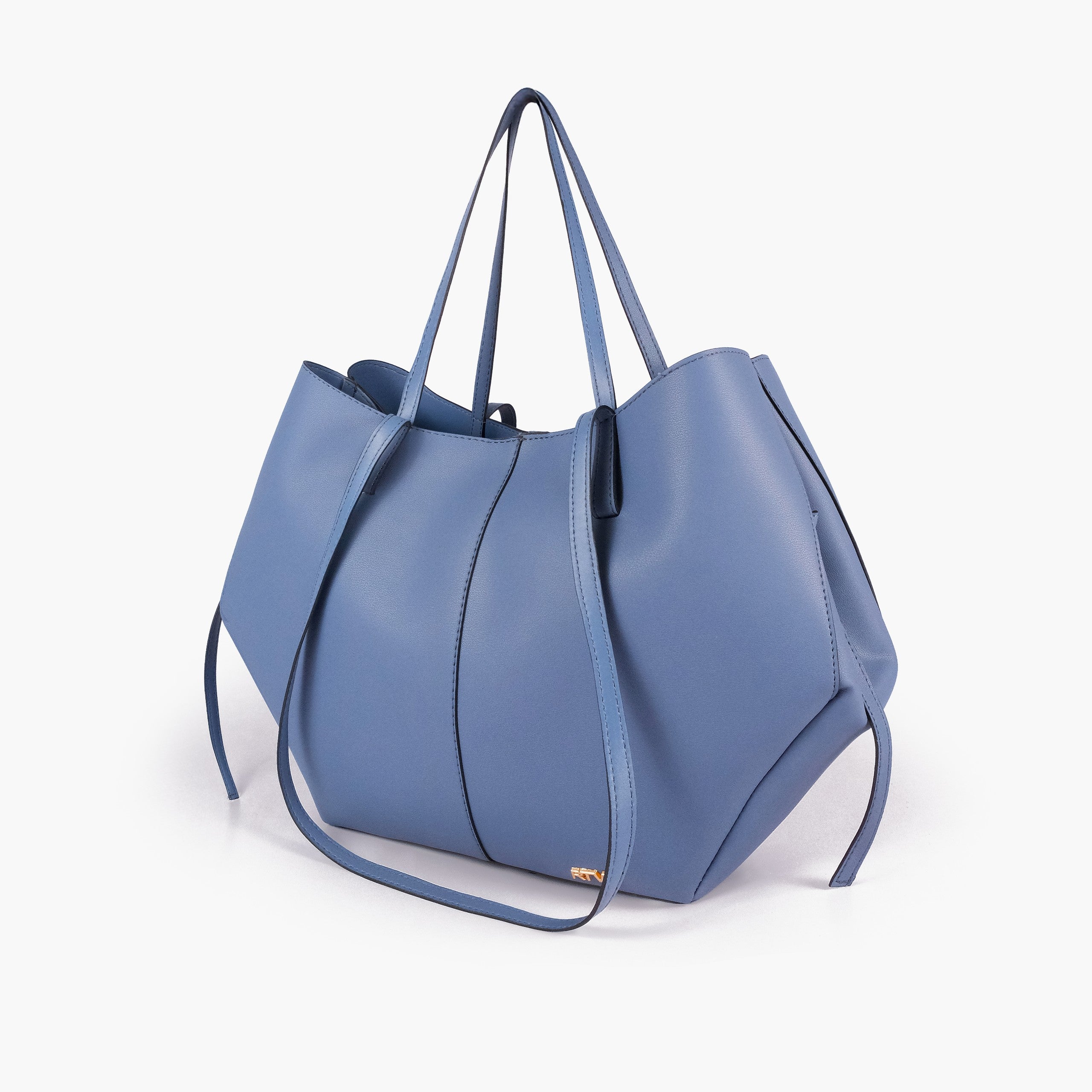 Sky blue atelier tote — hero 3/4 quarter view, dusty denim-blue smooth faux leather, wing-cut origami sides, slim handles, gold RTW logo at front base