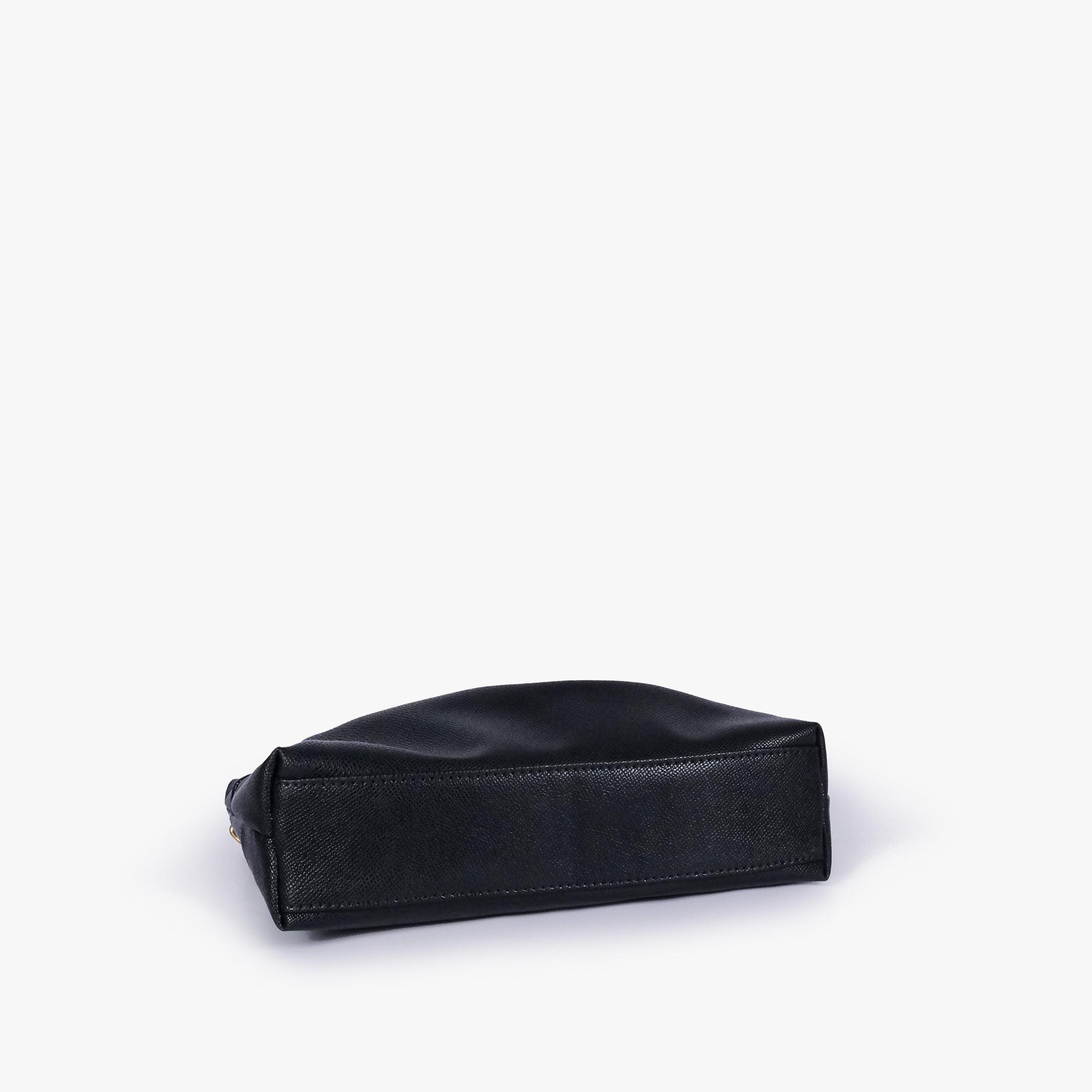 Black pleated clutch bag with chain — bottom view showing the stitched flat base and slim depth, deep black