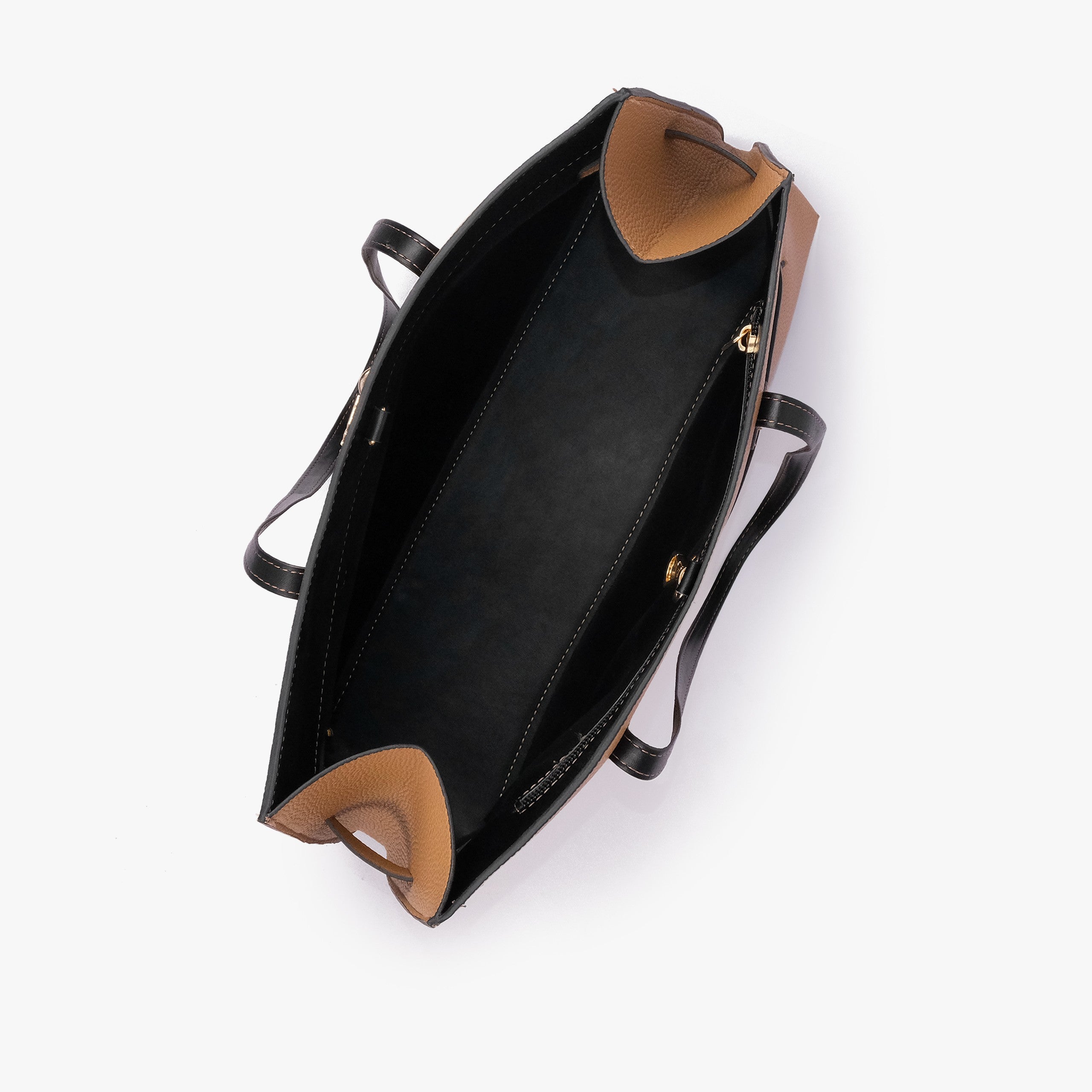 Coffee camel Monday Tote — interior top-down view showing smooth black lining, camel pebbled wing-cut corner folds, back-wall zipper with gold runner