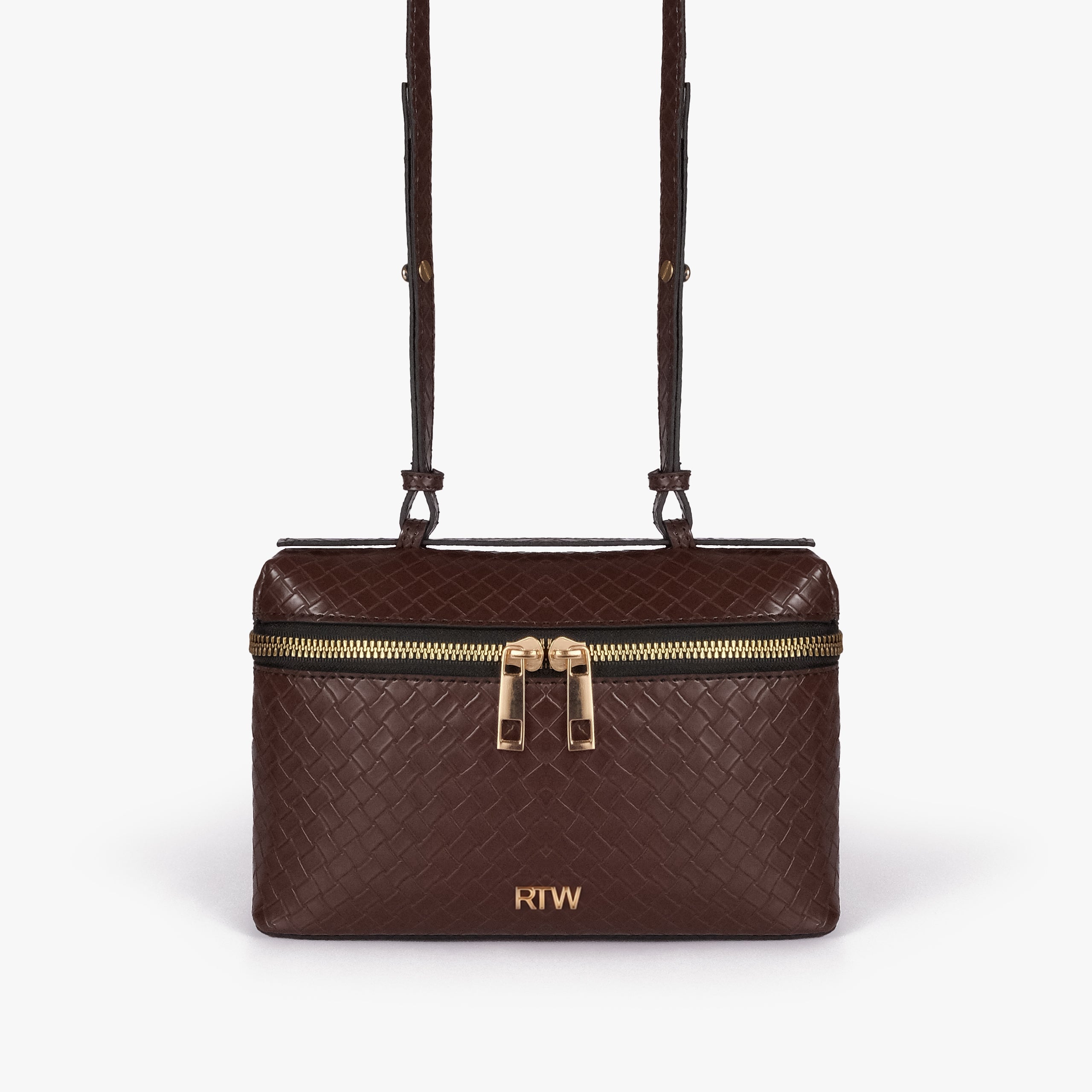 Chocolate brown weave vanity top-handle bag — front straight-on view showing the diamond-quilted vanity body, short top handle, long strap, wraparound zipper, and small front logo mark
