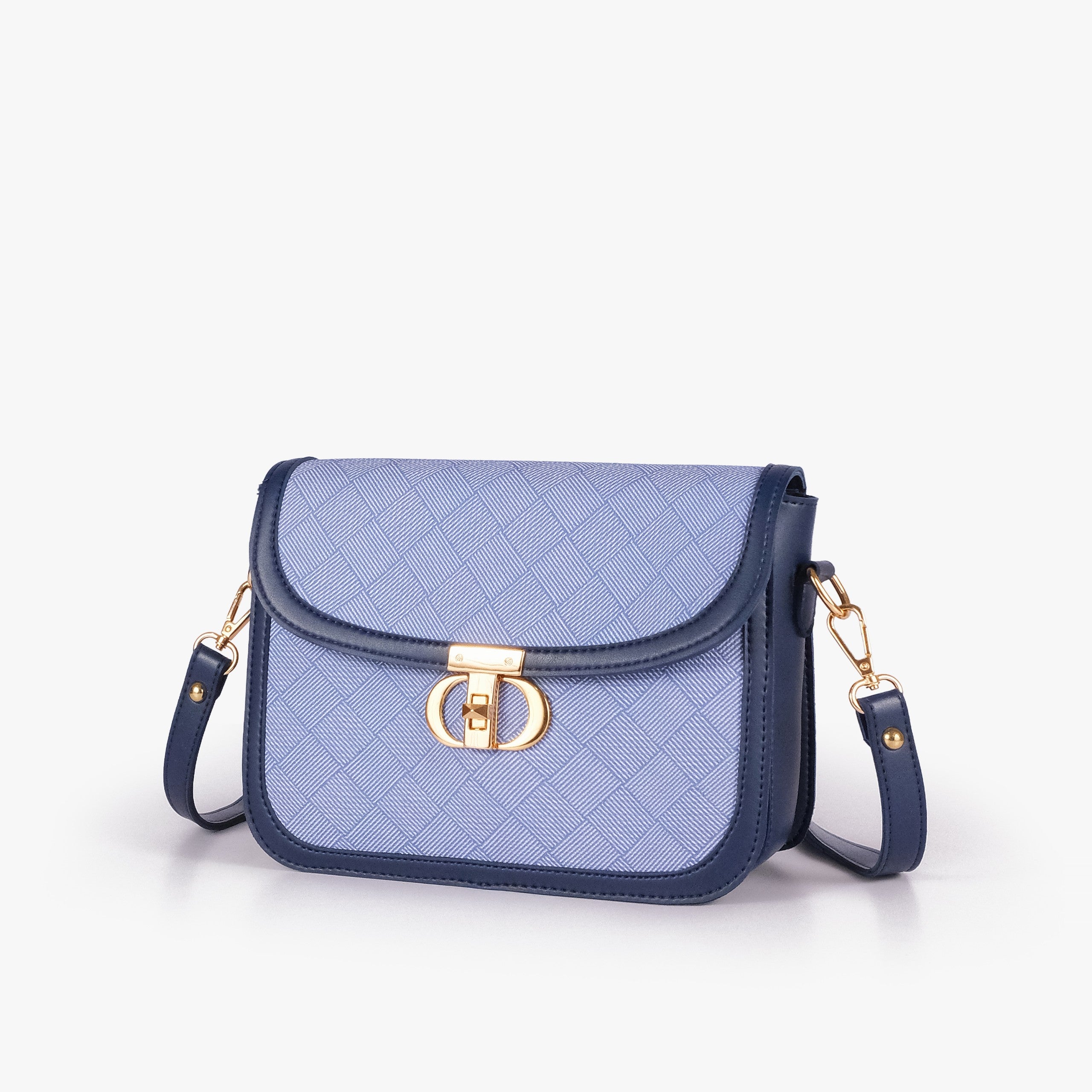 Navy contrast cross-body bag — hero 3/4 view, periwinkle dusty-blue box-texture panel, deep navy pebbled trim, gold CD twist-lock rockstud and strap