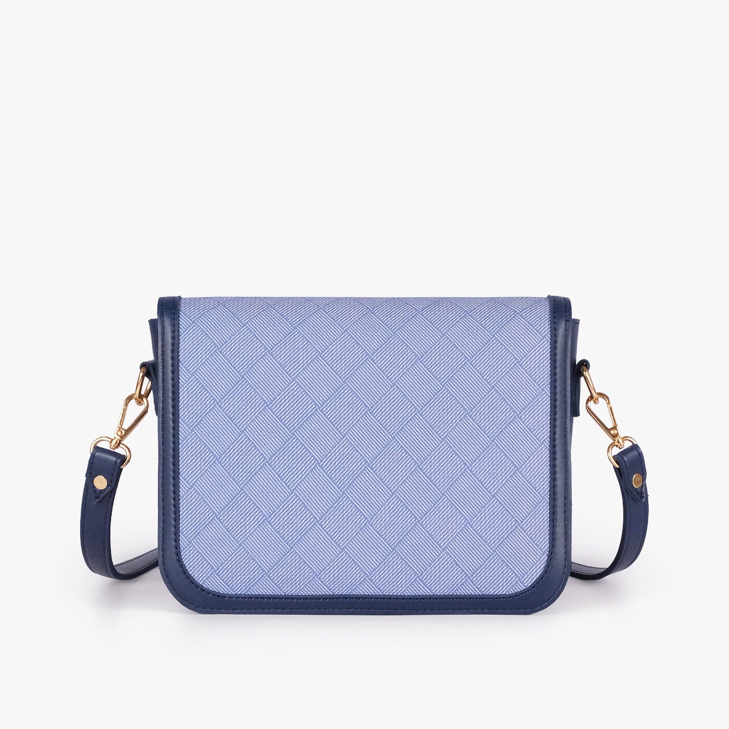 Navy contrast cross-body bag — back view showing periwinkle box-texture panel framed by deep navy pebbled trim