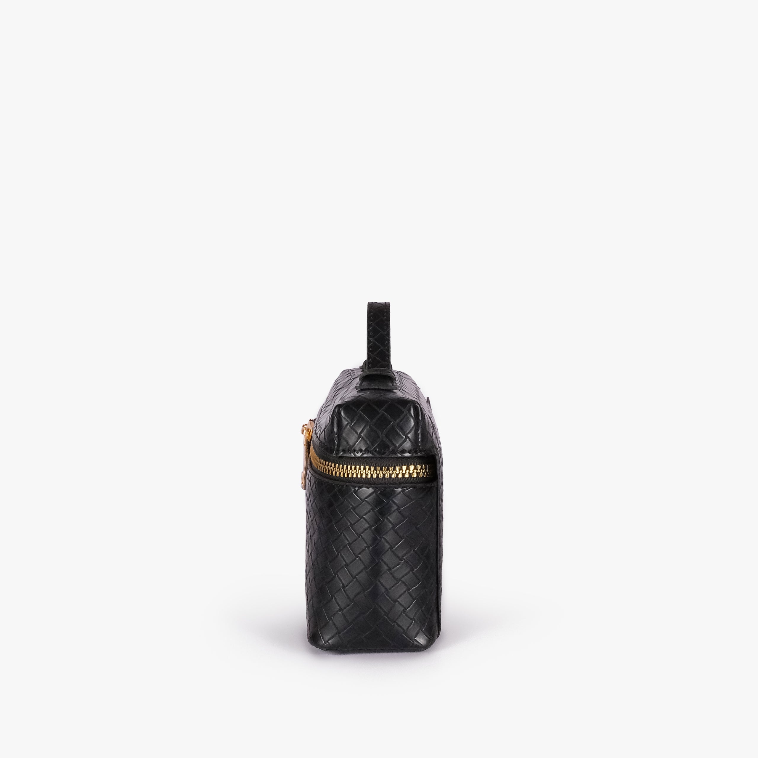 Black weave vanity top-handle bag — side profile showing the structured depth, wraparound zipper band near the top, side attachment tab, and long strap