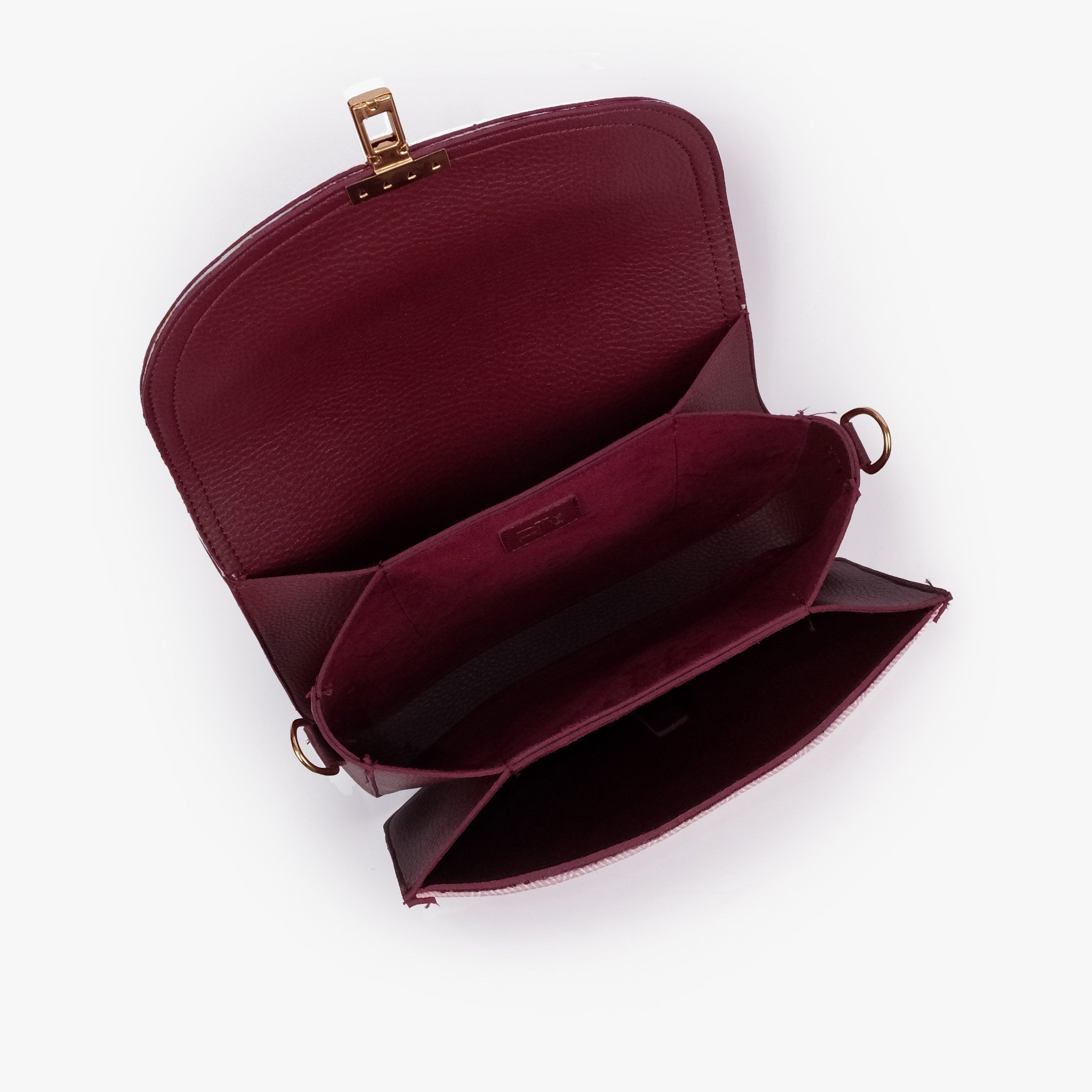 Pink contrast cross-body bag — interior open top-down, deep burgundy suede-feel lining, two compartments and center divider slip pocket