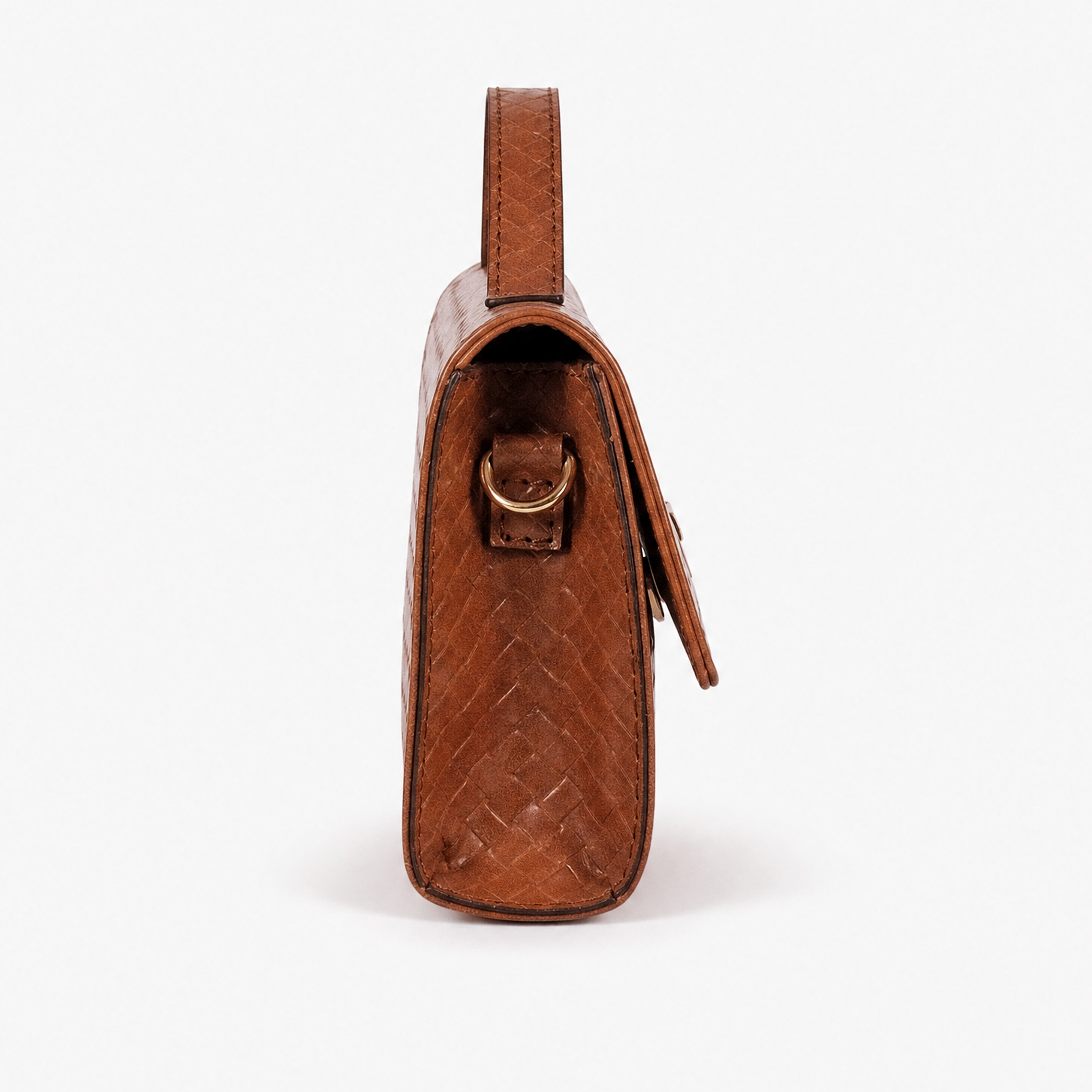 Warm terracotta woven weave clutch — side profile showing gold D-ring attachment, gusset depth, and top handle
