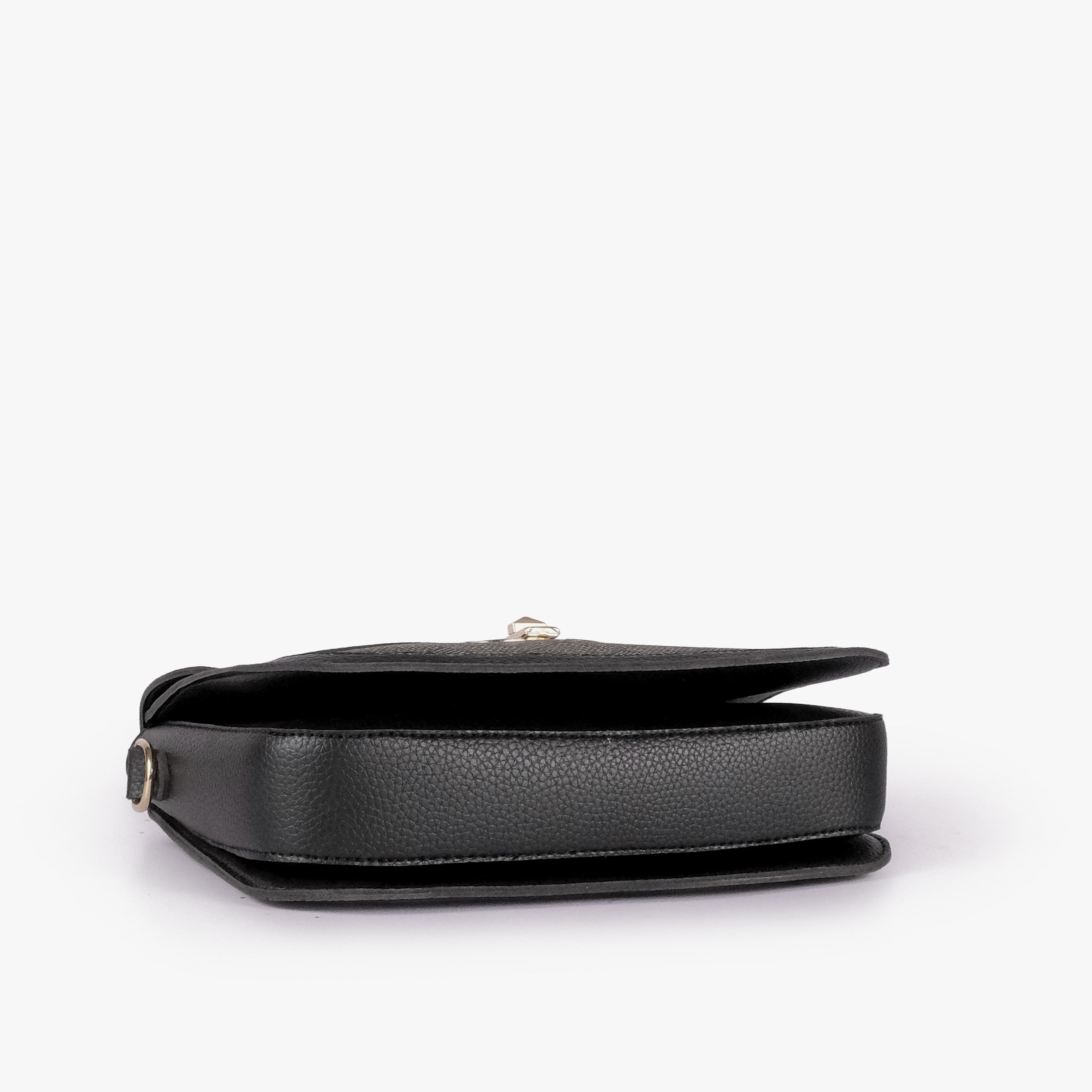 Charcoal contrast cross-body bag — tilted underside flat lay showing flap edge, bag depth, and base