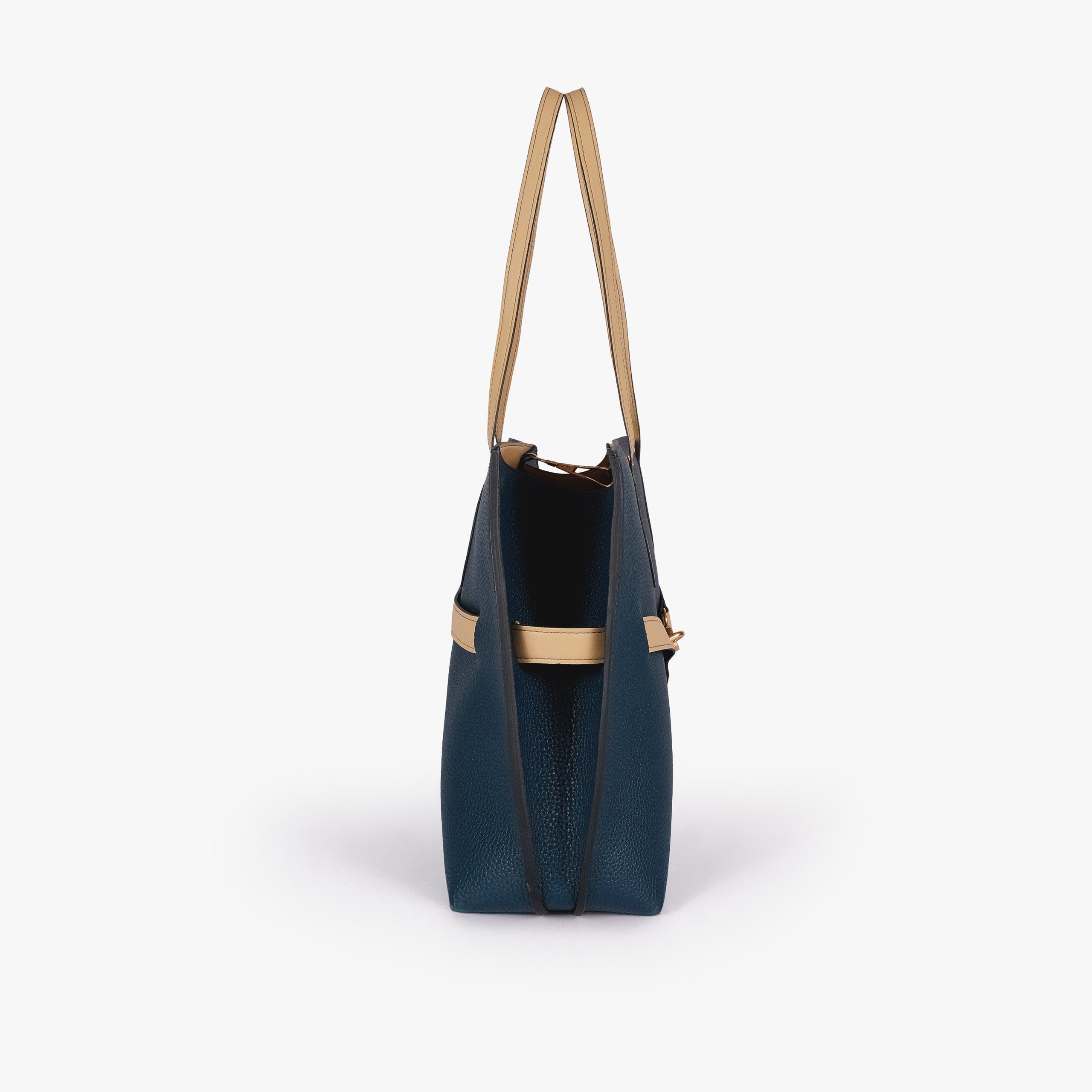 Teal Monday Tote — side profile showing slim gusset and wing-cut origami corner fold with cream accent edging