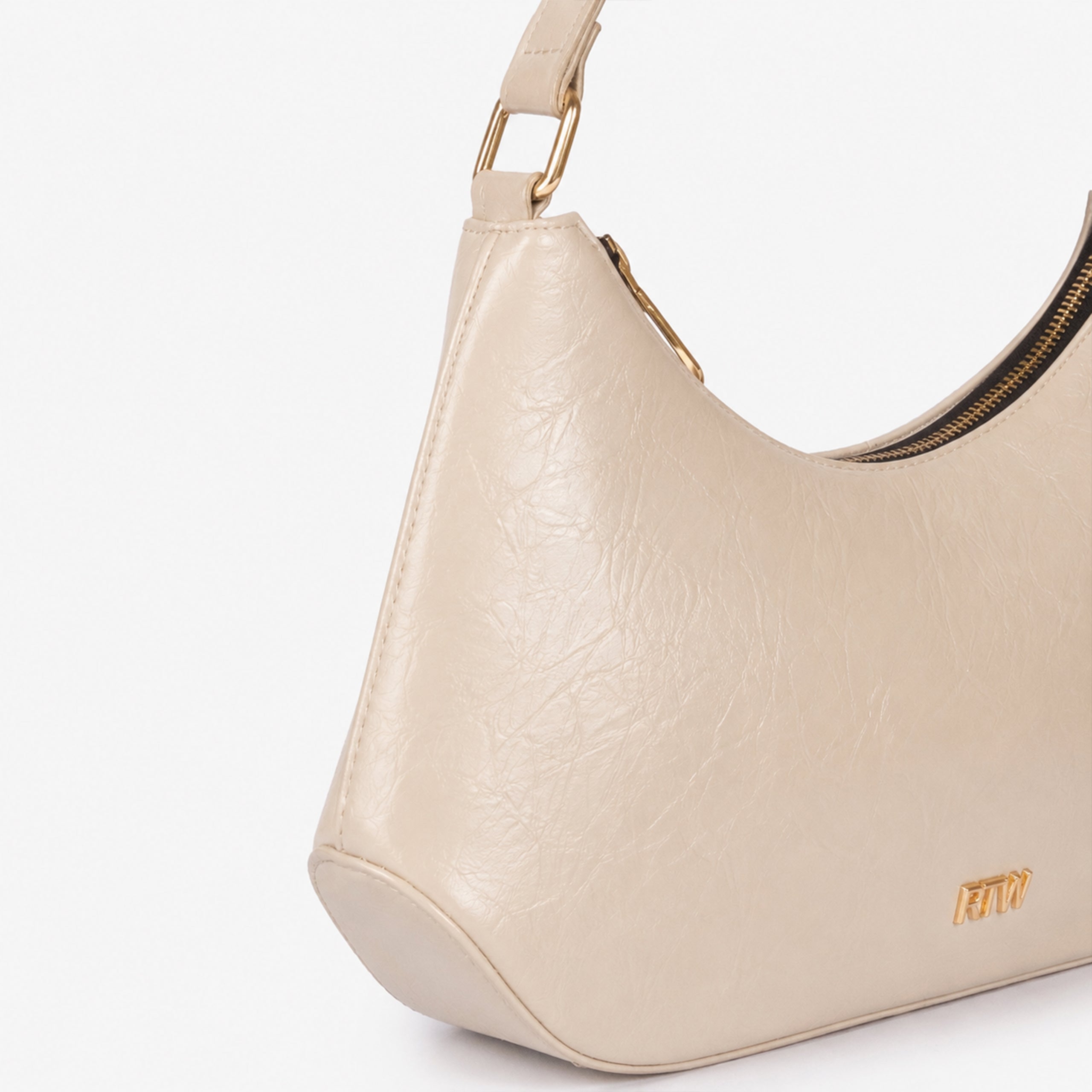 Pearl crinkle shoulder bag — closeup showing the crinkled faux-leather texture and crinkled texture, zip-top detail, and minimal gold-tone detail