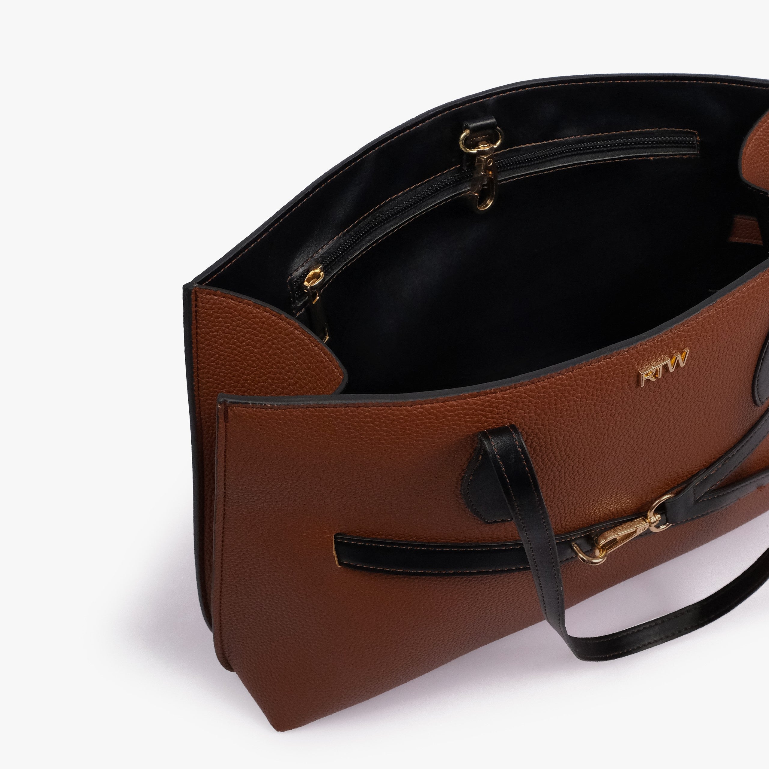 Brown cognac Monday Tote — interior angled view showing back-wall zipped pocket, gold zipper, black lining, gold D-fittings