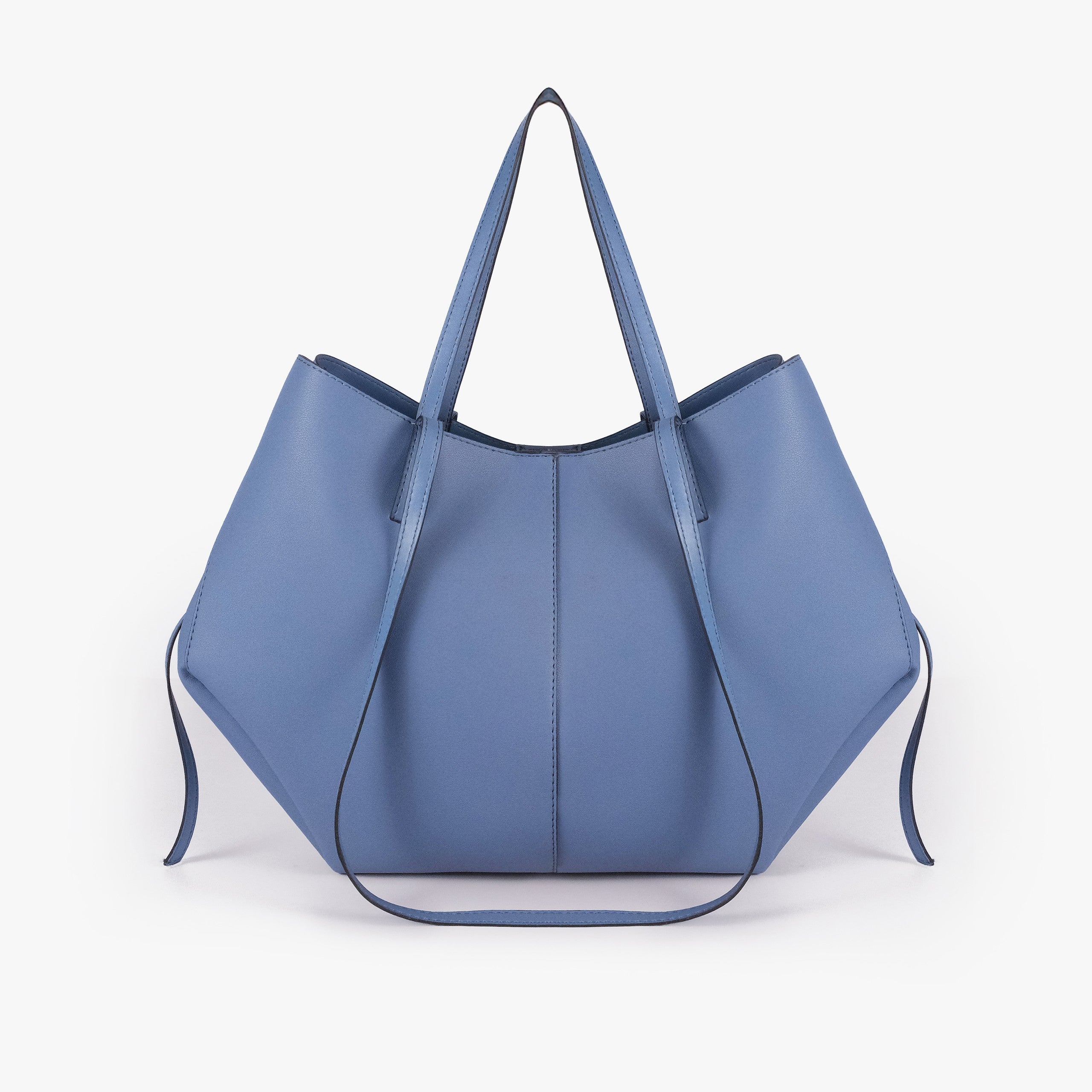 Sky blue atelier tote — back view alone showing wing-cut origami panels and slim handles
