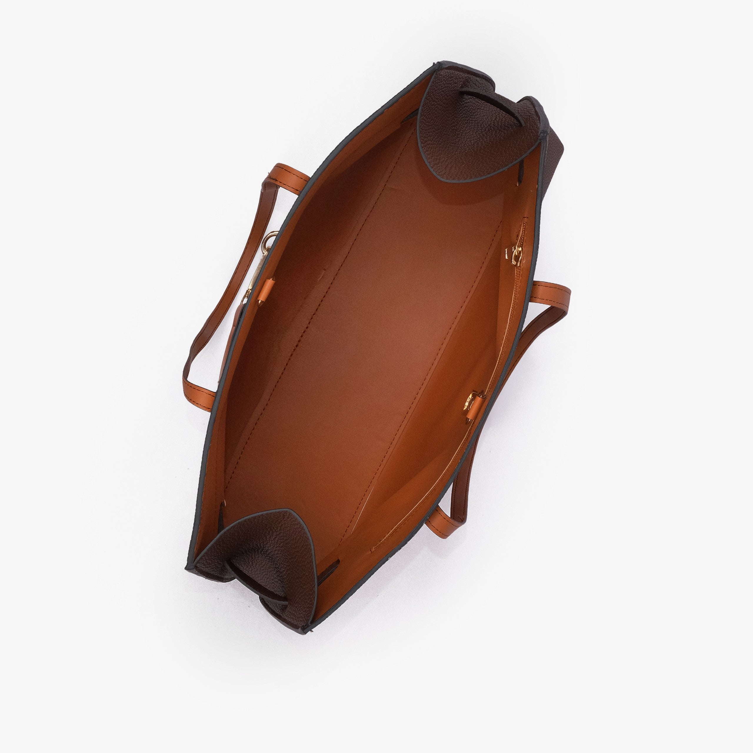 Dark brown Monday Tote — interior top-down view showing smooth cognac lining, dark brown pebbled wing-cut corner folds, back-wall zipper with gold runner
