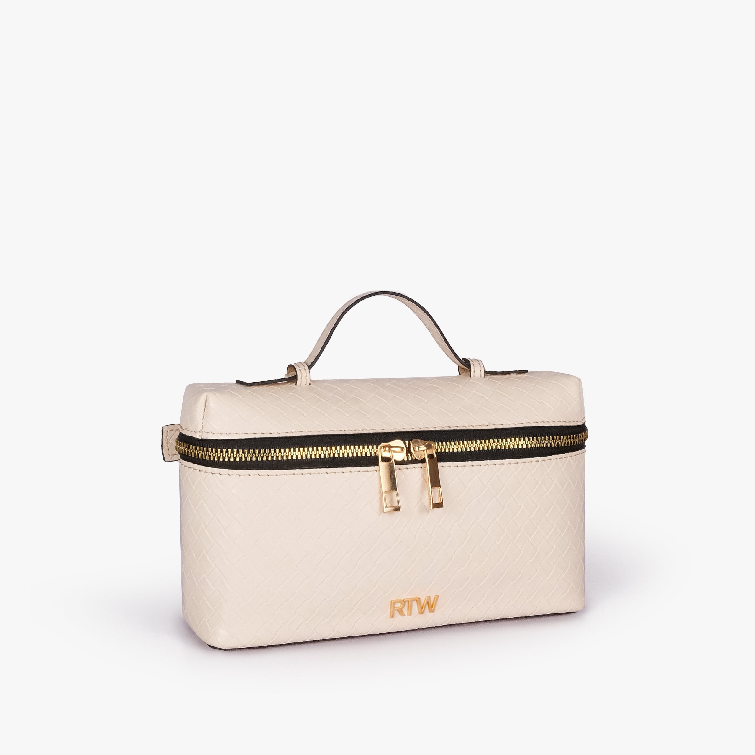 Cream weave vanity top-handle bag — 3/4 quarter view showing the compact boxy vanity shape, rounded edges, diamond quilting, strap attachment, and side depth