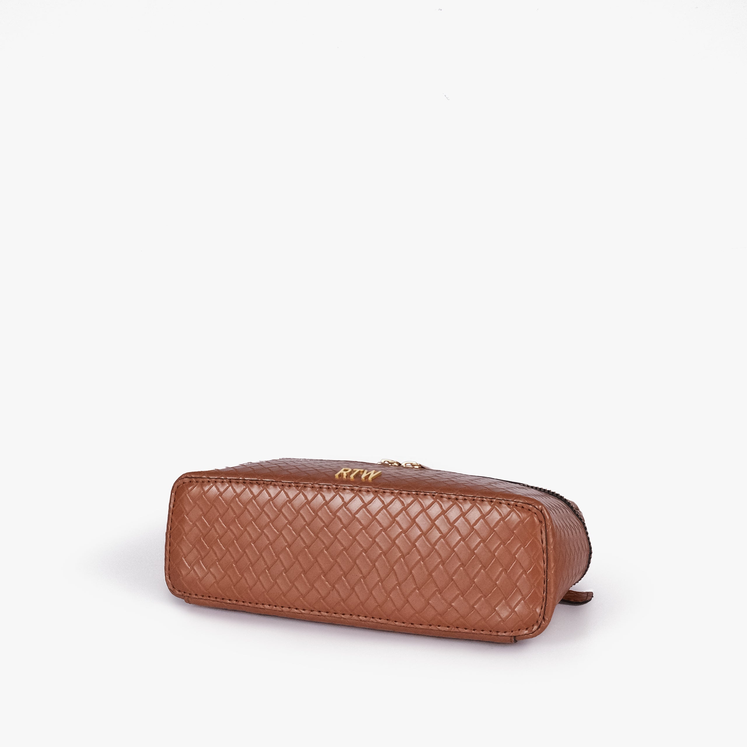 Terracotta weave vanity top-handle bag — base angle showing the elongated flat rectangular bottom with rounded corners and continuous diamond quilting