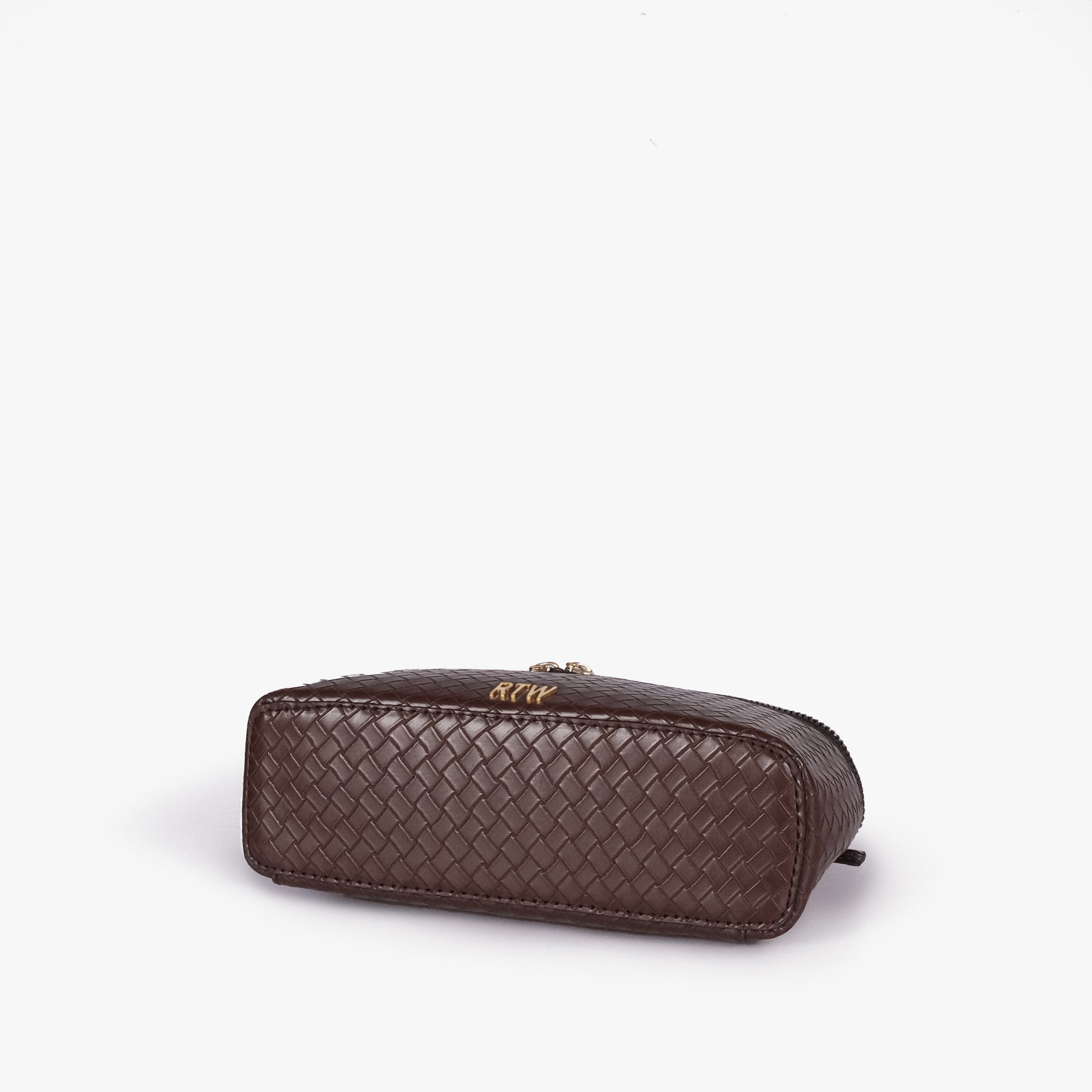 Chocolate brown weave vanity top-handle bag — base angle showing the elongated flat rectangular bottom with rounded corners and continuous diamond quilting