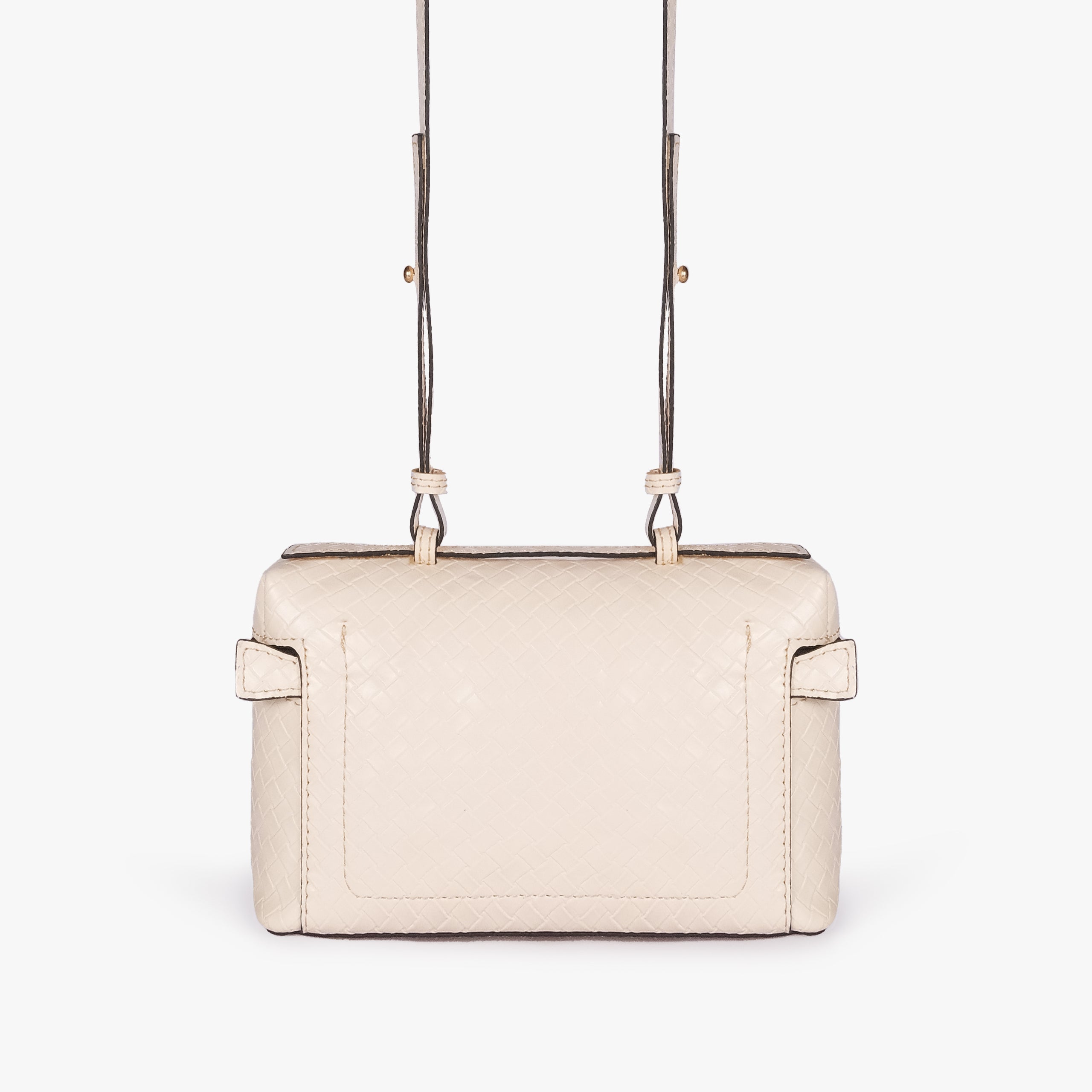 Cream weave vanity top-handle bag — back view showing the plain quilted back panel, top handle, long strap, flat base line, and no visible exterior pocket
