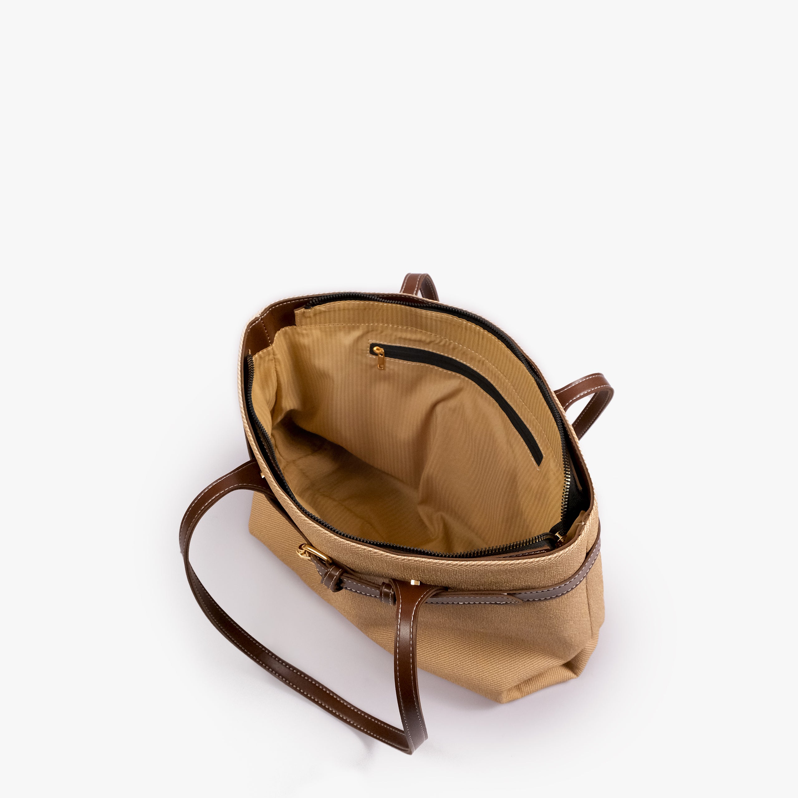 Brown belted tote bag — open-top interior view showing the tan interior, structured rim, long handles, and belted front detail, cream-tan textured body with brown smooth faux-leather trim