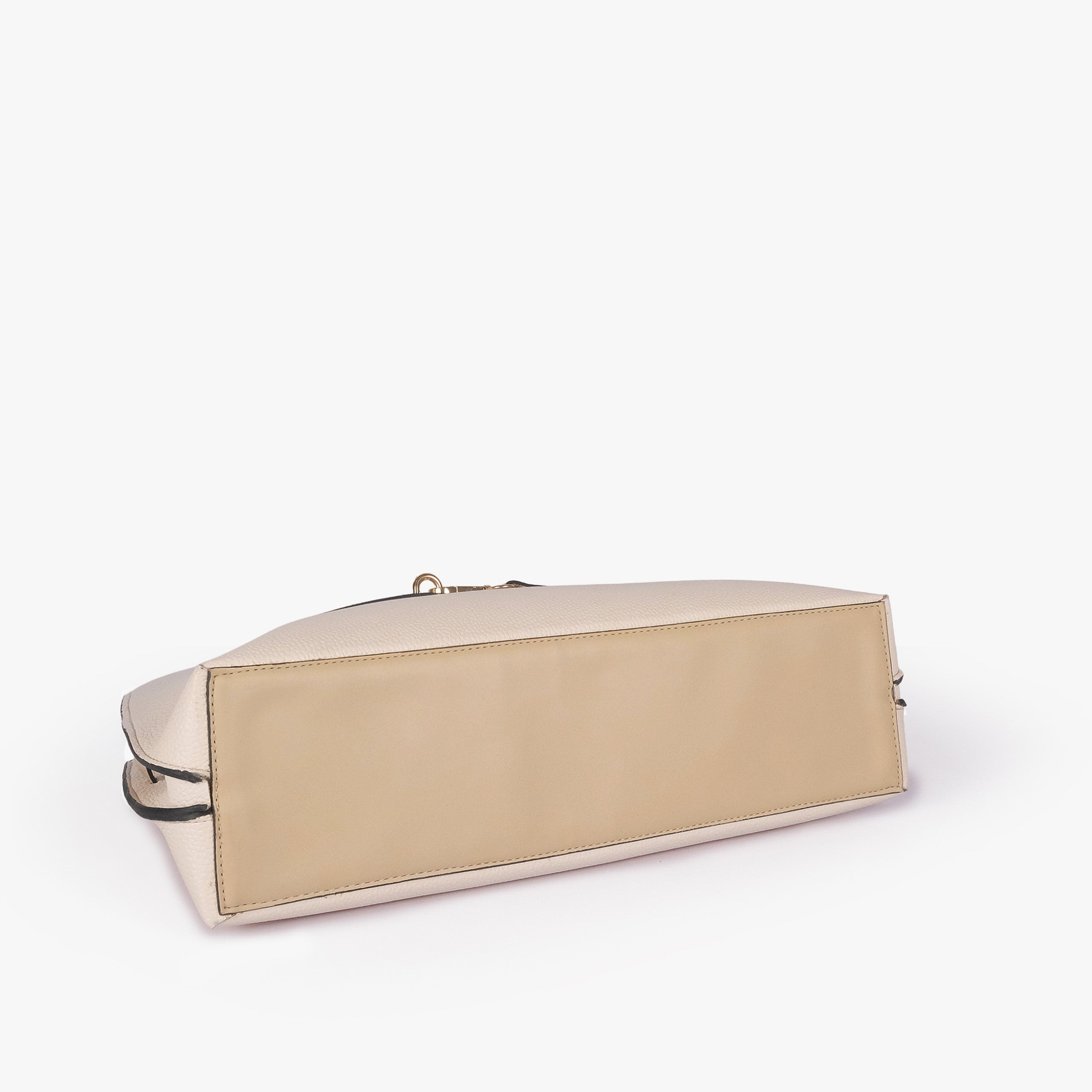Off-white cream Monday Tote — underside tilted view showing reinforced tan smooth base panel and cream pebbled sides
