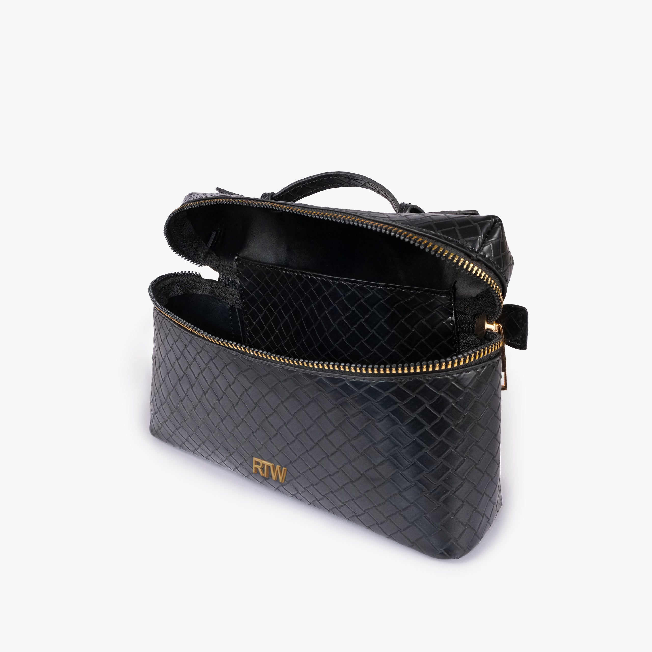 Black weave vanity top-handle bag — interior open view showing the lid lifted upward, zip-around opening, and lined single main compartment