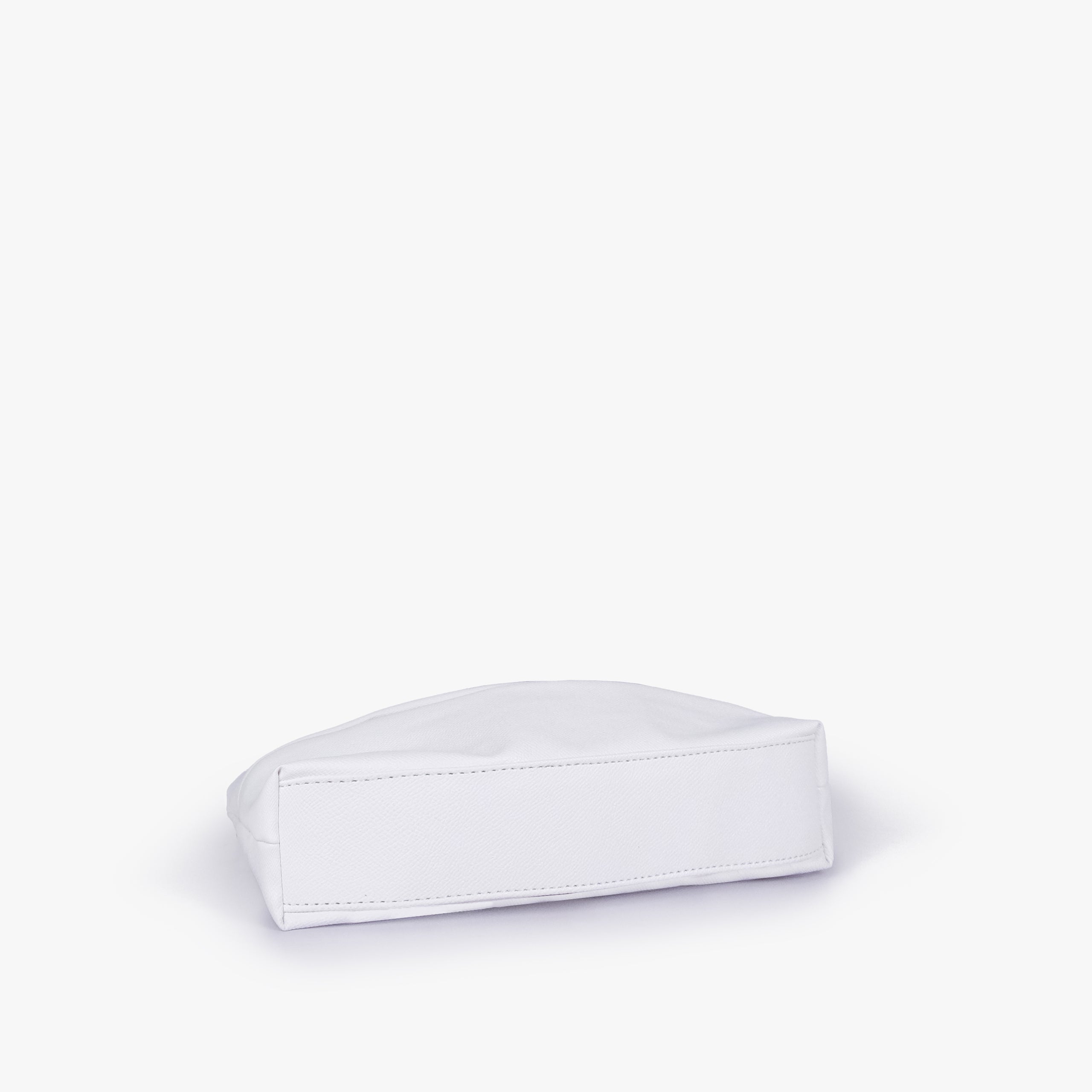 White pleated clutch bag with chain — bottom view showing the stitched flat base and slim depth, bright white