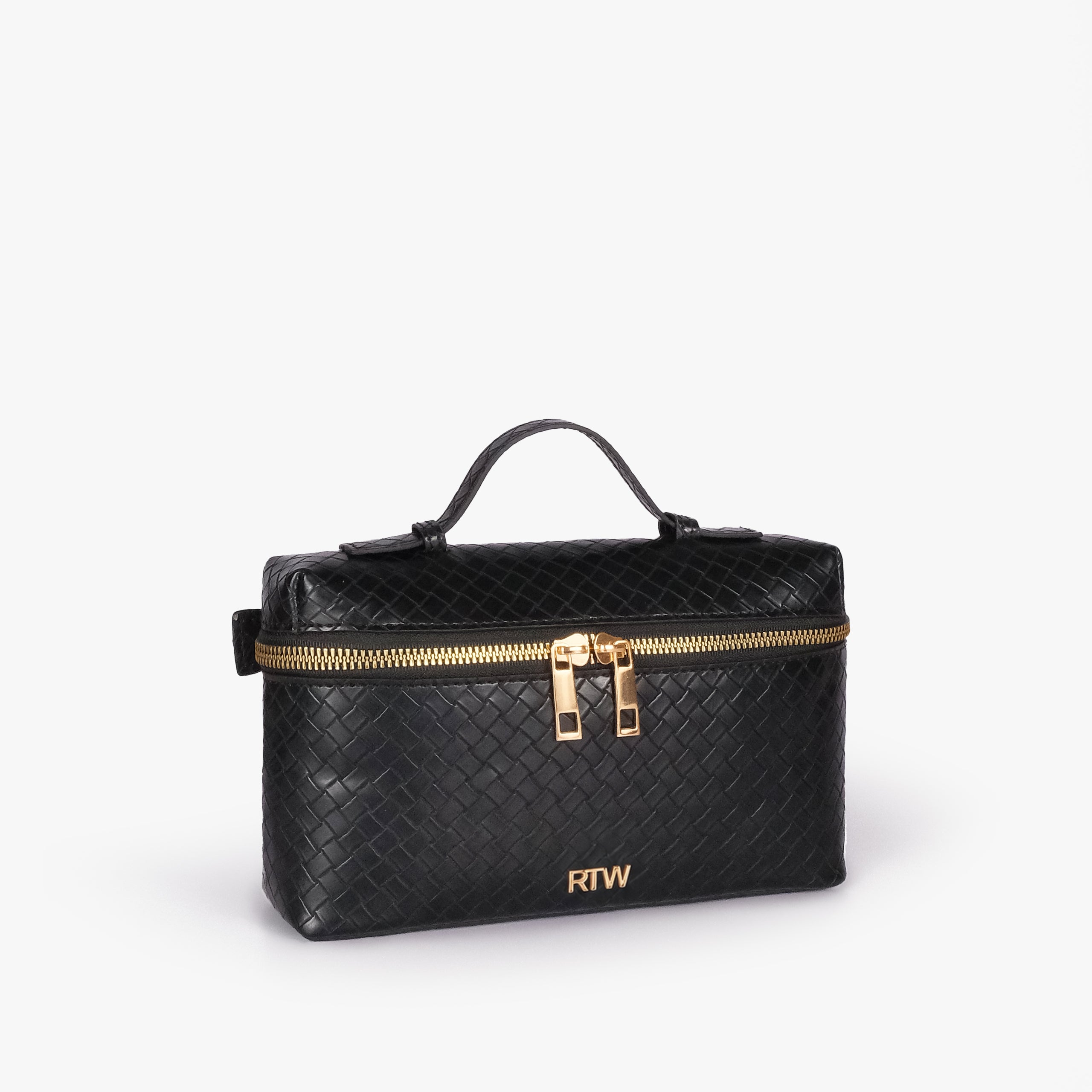 Black weave vanity top-handle bag — 3/4 quarter view showing the compact boxy vanity shape, rounded edges, diamond quilting, strap attachment, and side depth