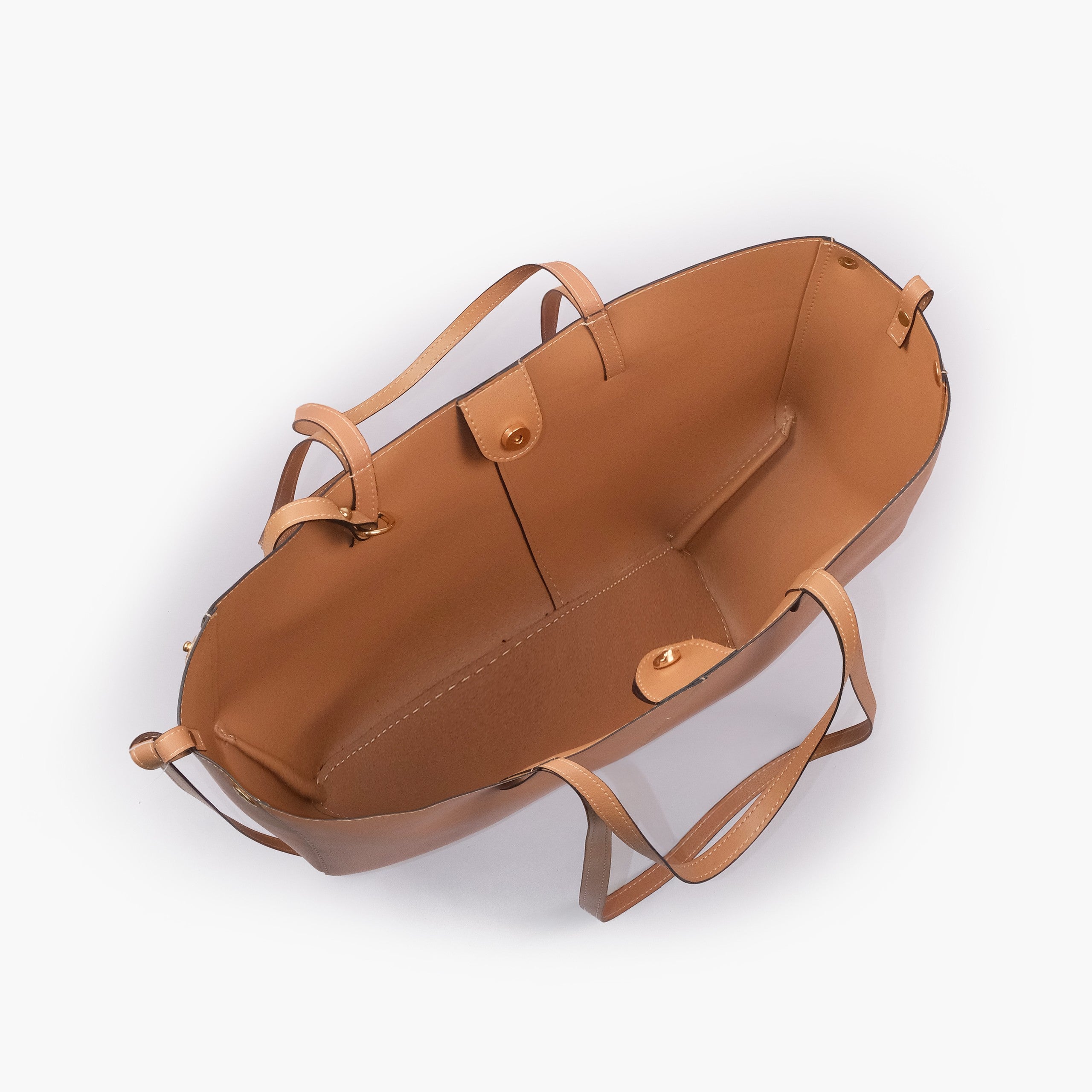 Coffee atelier tote — interior top-down view with smooth warm cognac-tan faux leather lining, center divider panel, gold magnetic snap