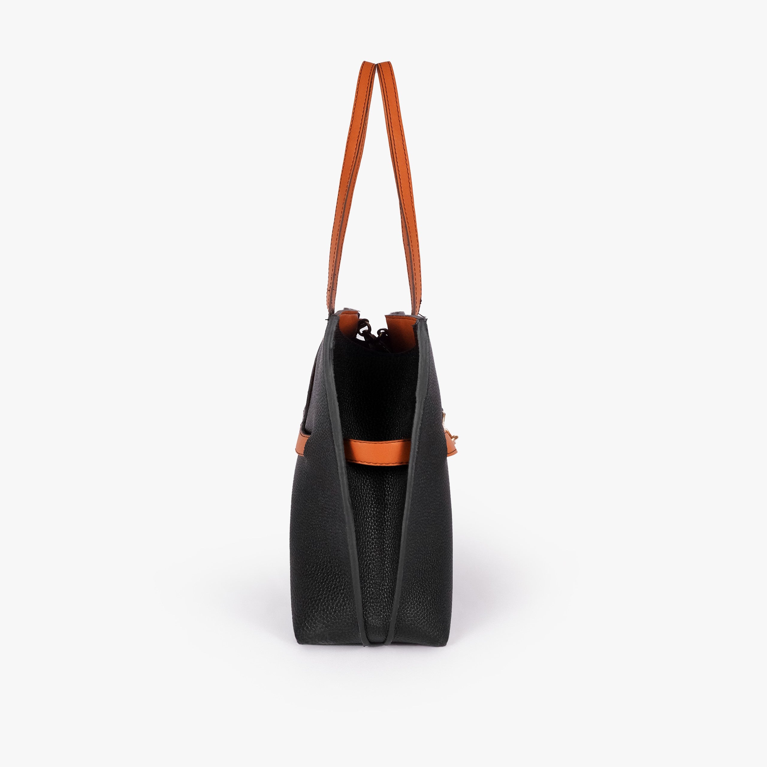 Black Monday Tote — side profile showing slim gusset and wing-cut origami corner fold with burnt orange accent edging