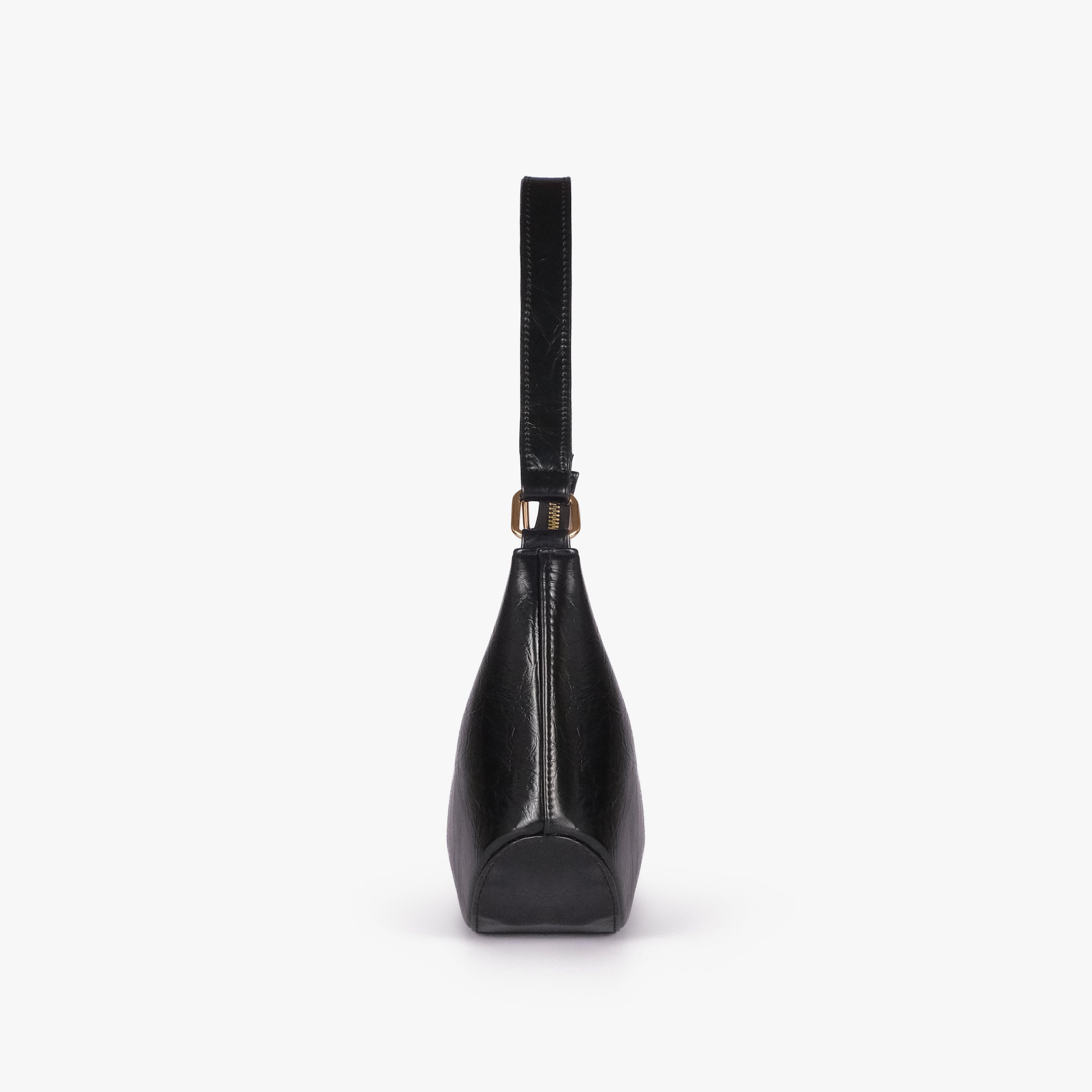Black crinkle shoulder bag — side profile showing the tapered depth and arched shoulder handle