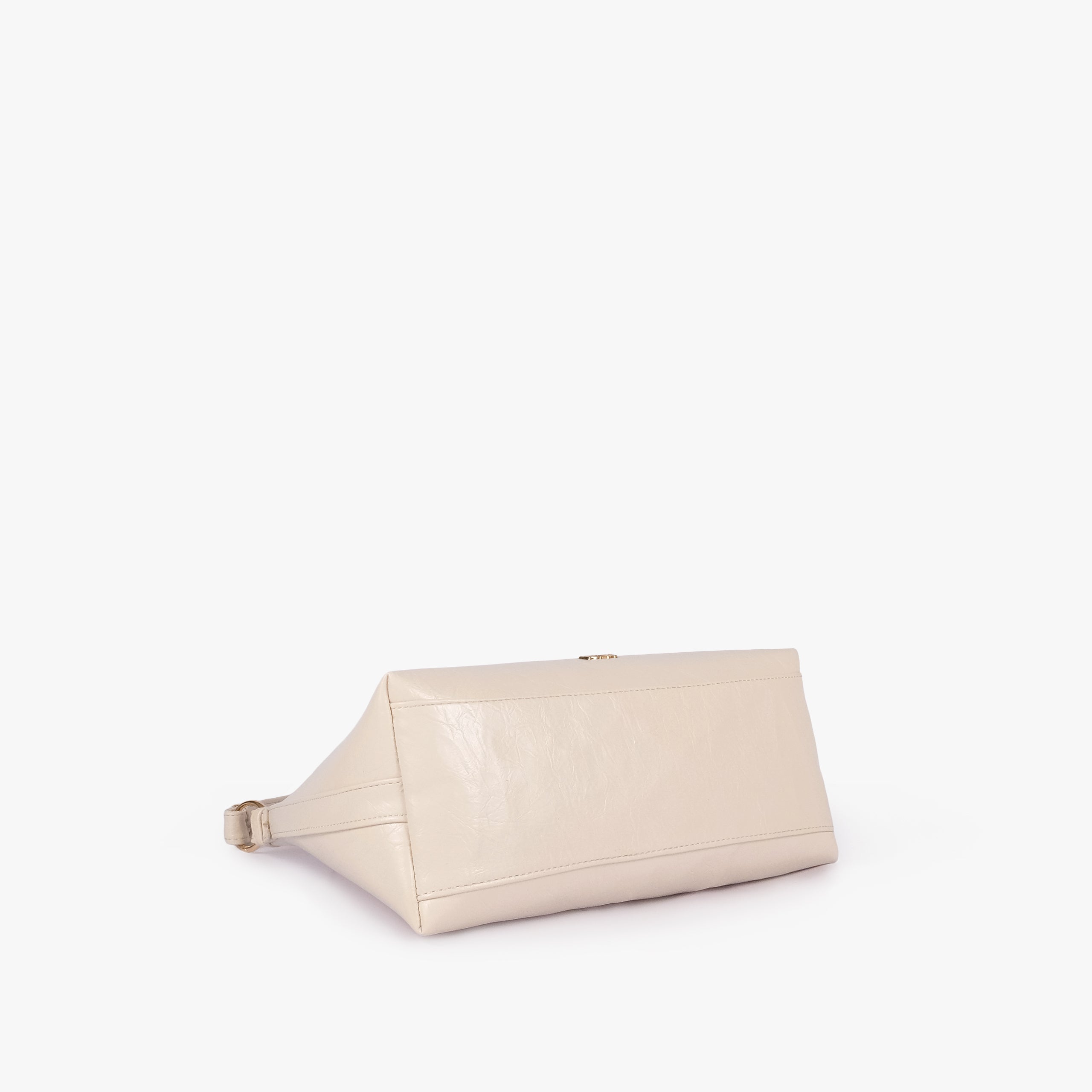 Pearl crinkle crescent hobo — base view showing the matching faux-leather bottom and softly structured shape