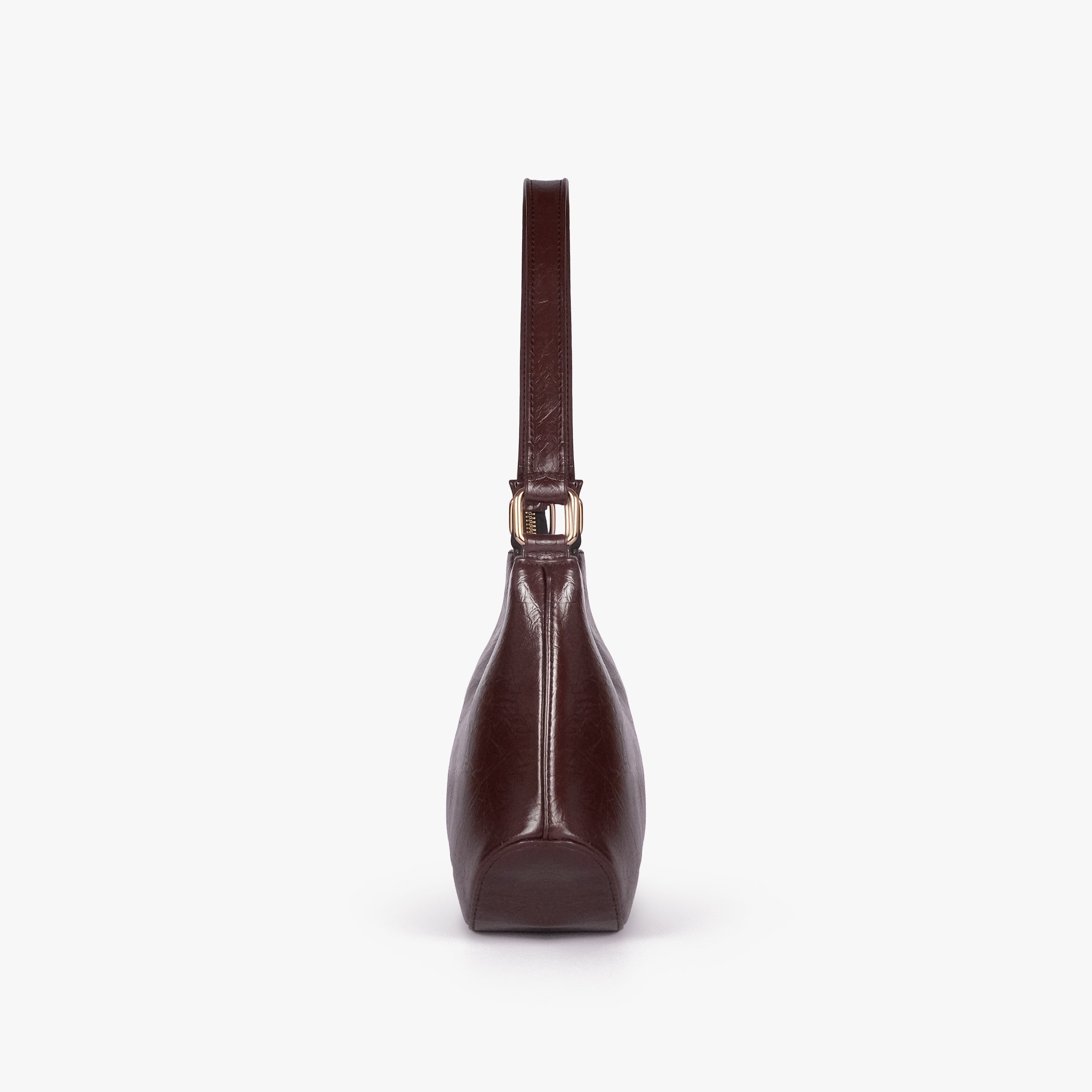 Dark brown crinkle shoulder bag — side profile showing the tapered depth and arched shoulder handle